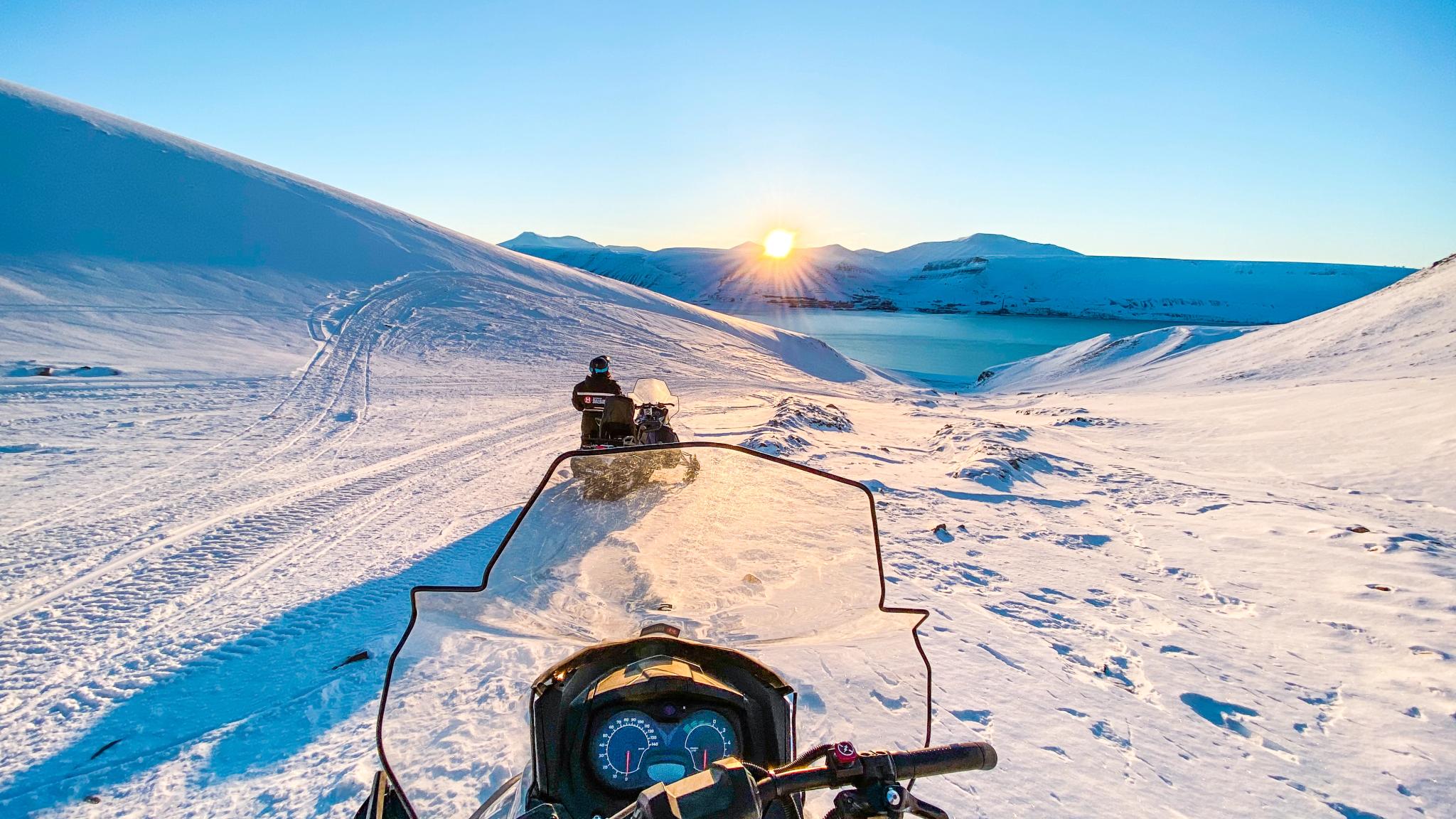 A sunset on Svalbard seen from an electric snowmobile
