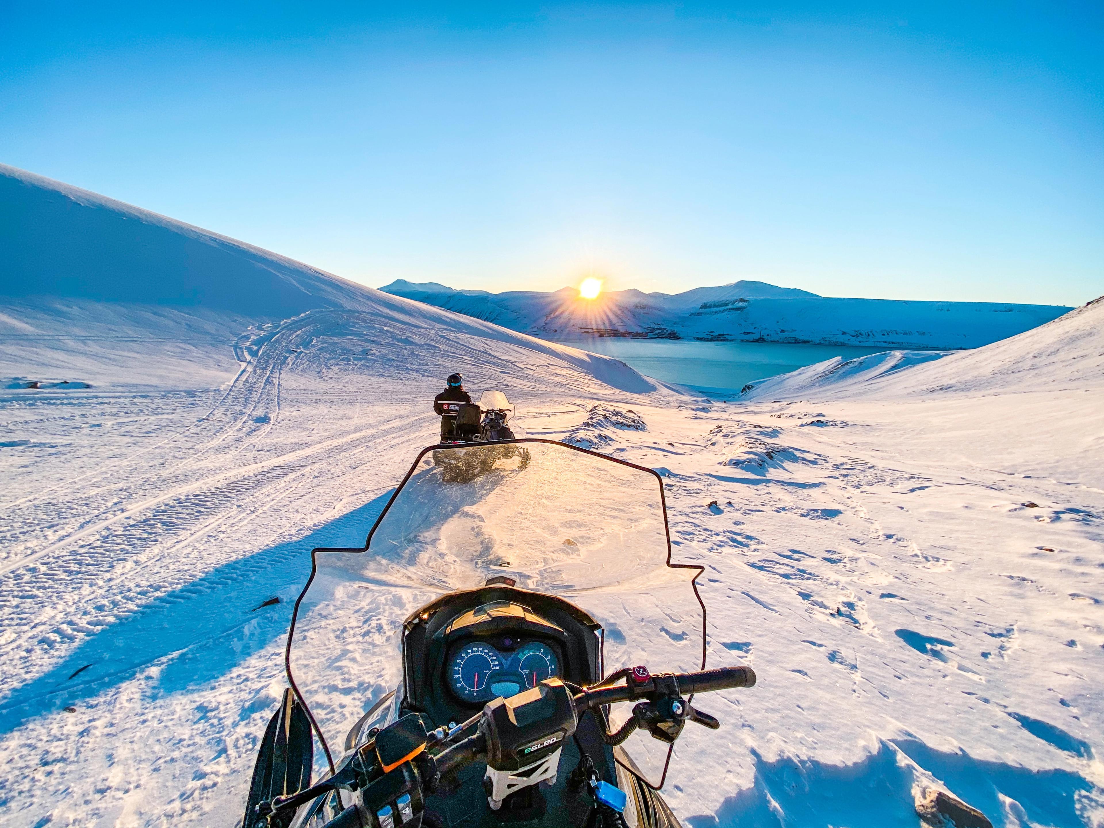 A sunset on Svalbard seen from an electric snowmobile