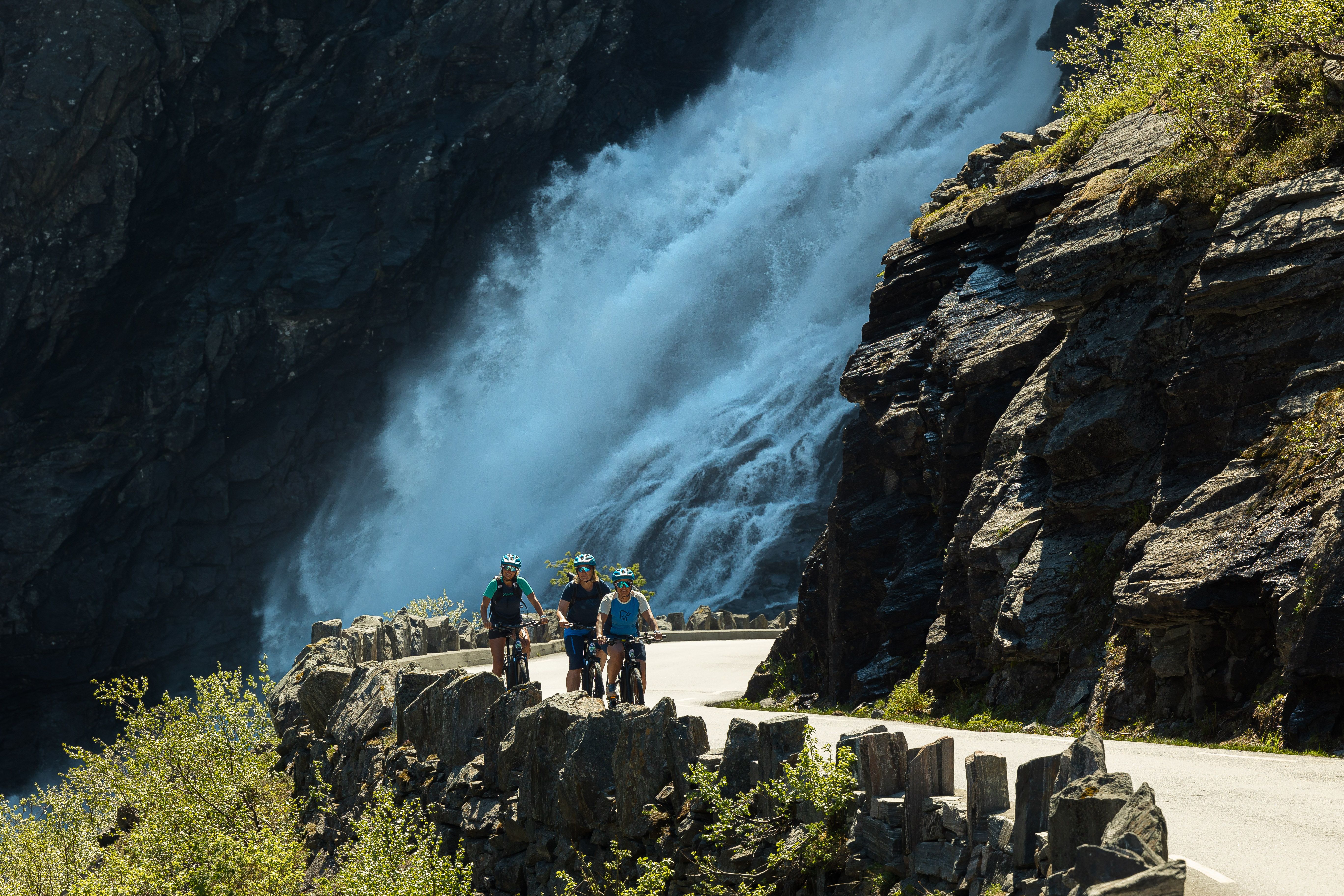 People cycling at Trollstigen in Åndalsnes, Norway