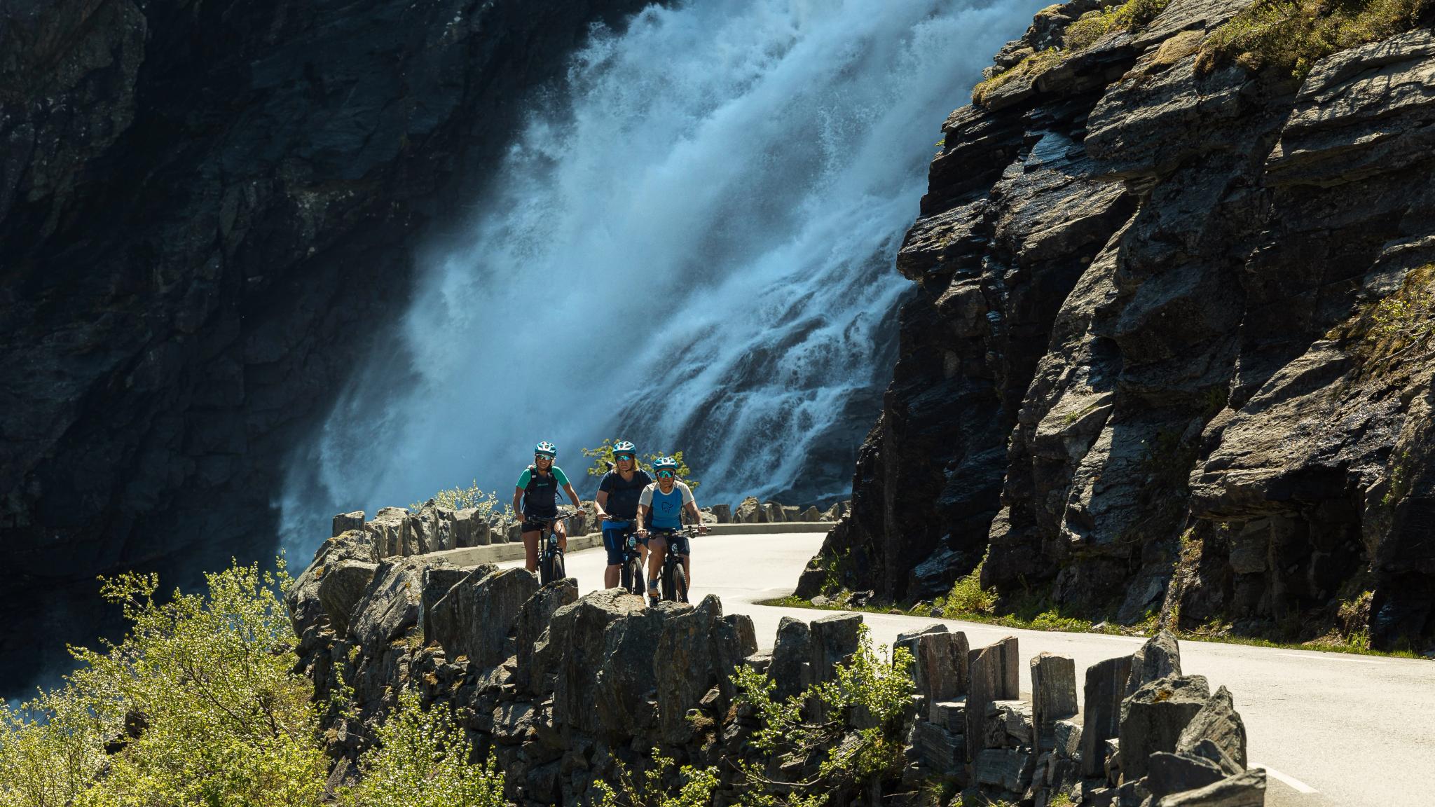 People cycling at Trollstigen in Åndalsnes, Norway
