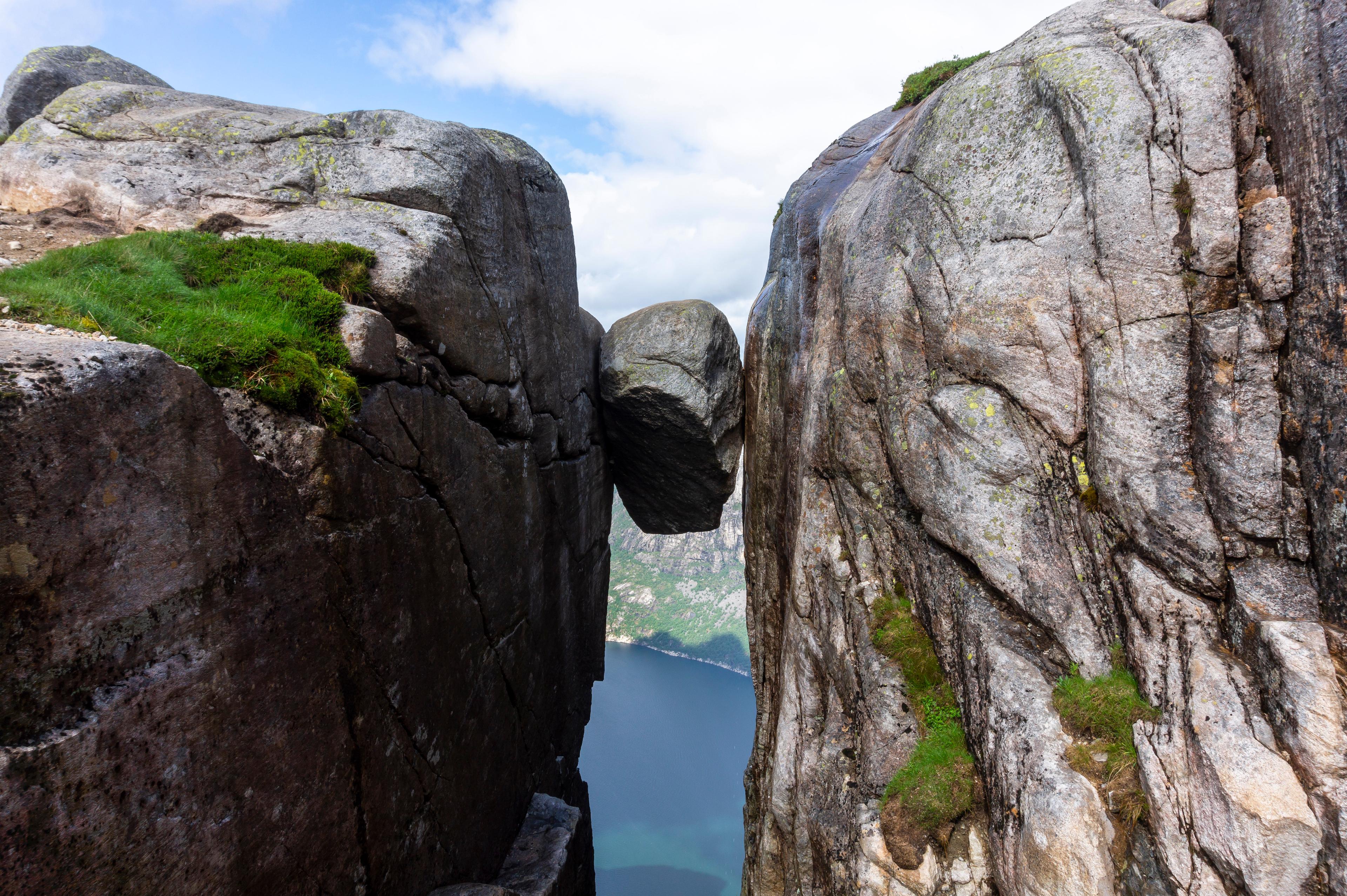 The Kjeragbolten boulder wedged in a mountain crevasse above the Lysefjord in Norway
