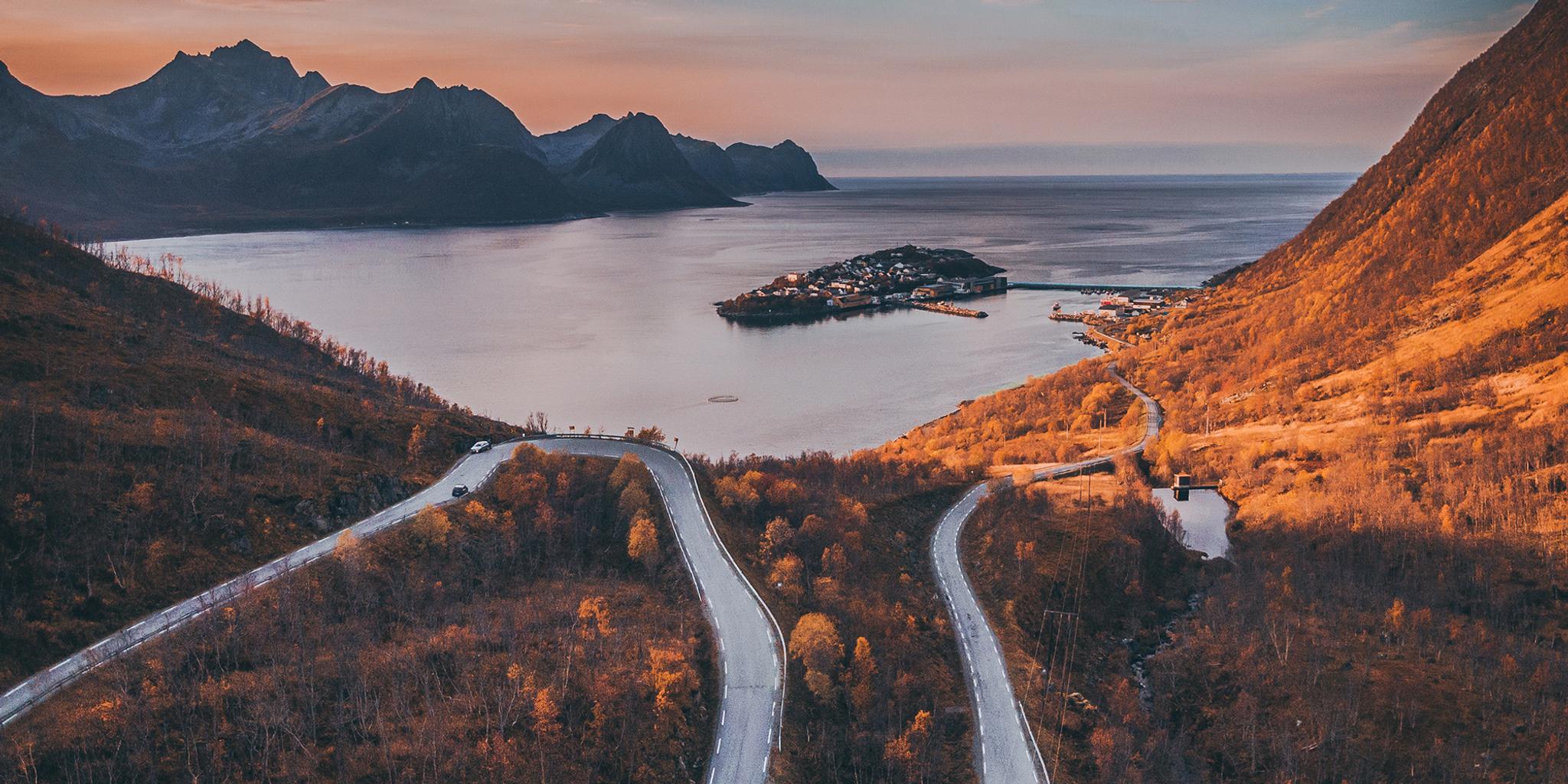 Tiny village of Husøy and winding roads in Senja
