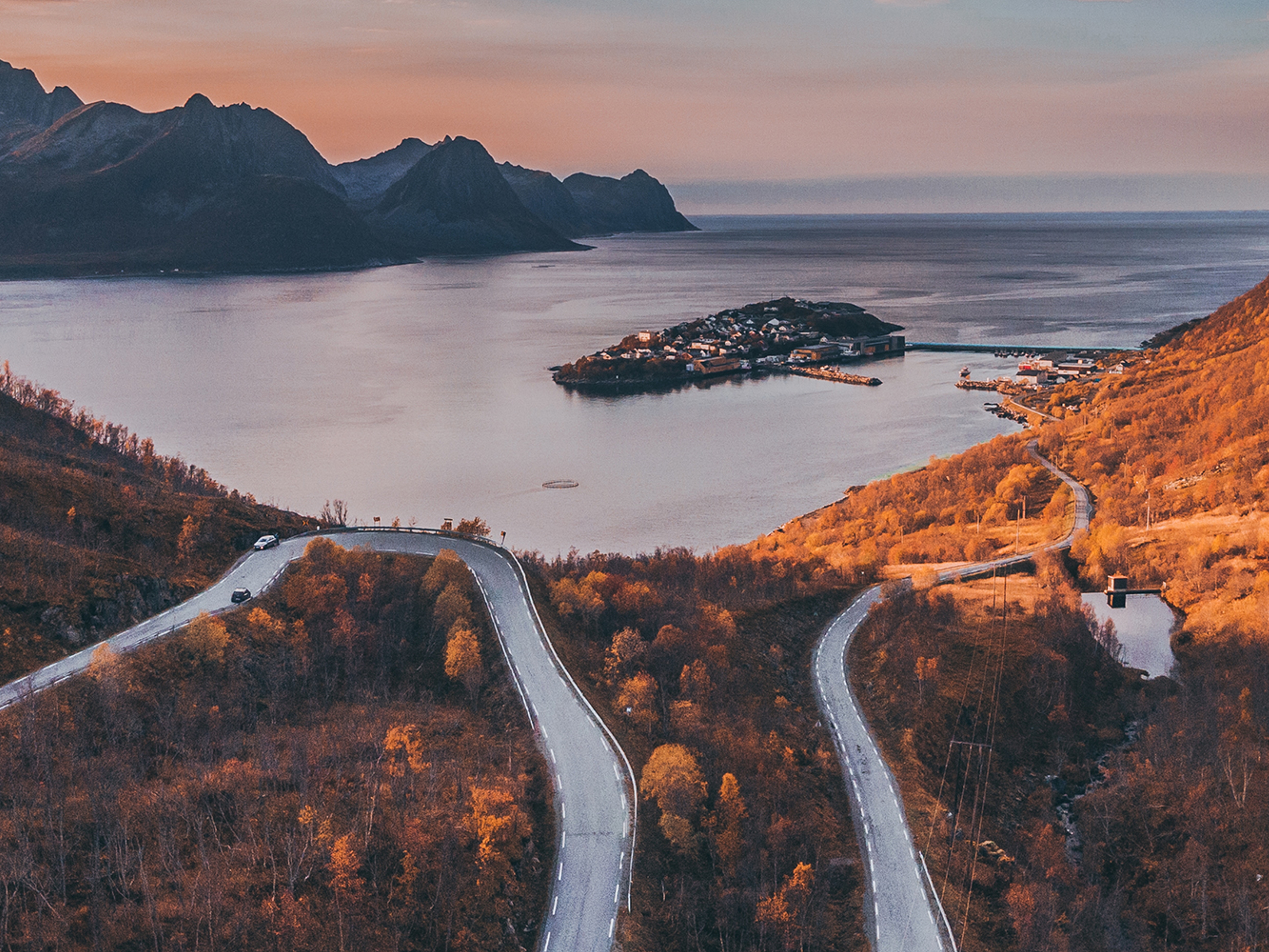 Tiny village of Husøy and winding roads in Senja