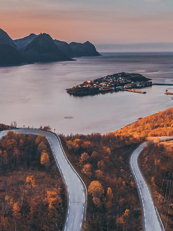 Tiny village of Husøy and winding roads in Senja