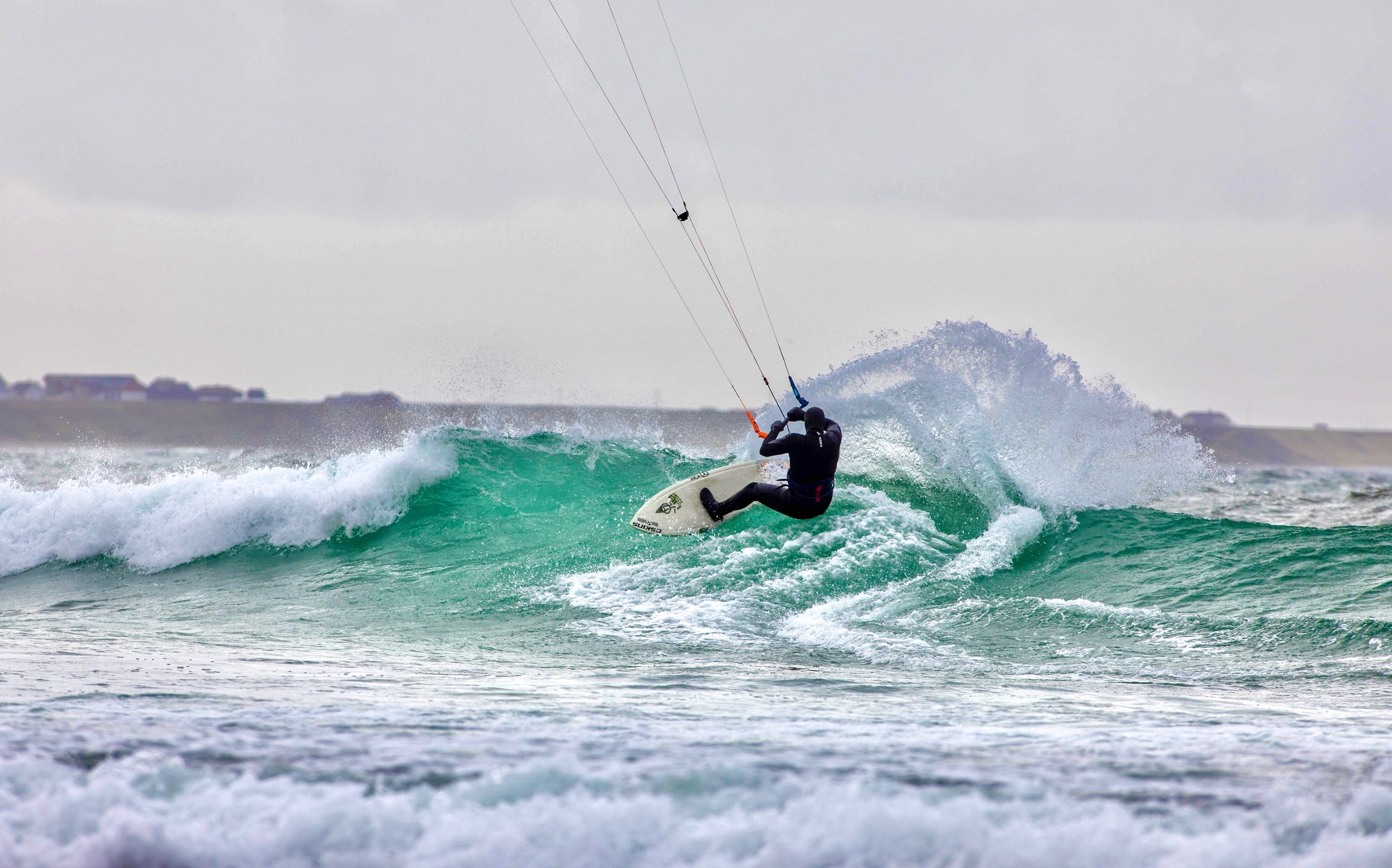 A person kiting on a wave in Fjord Norway.