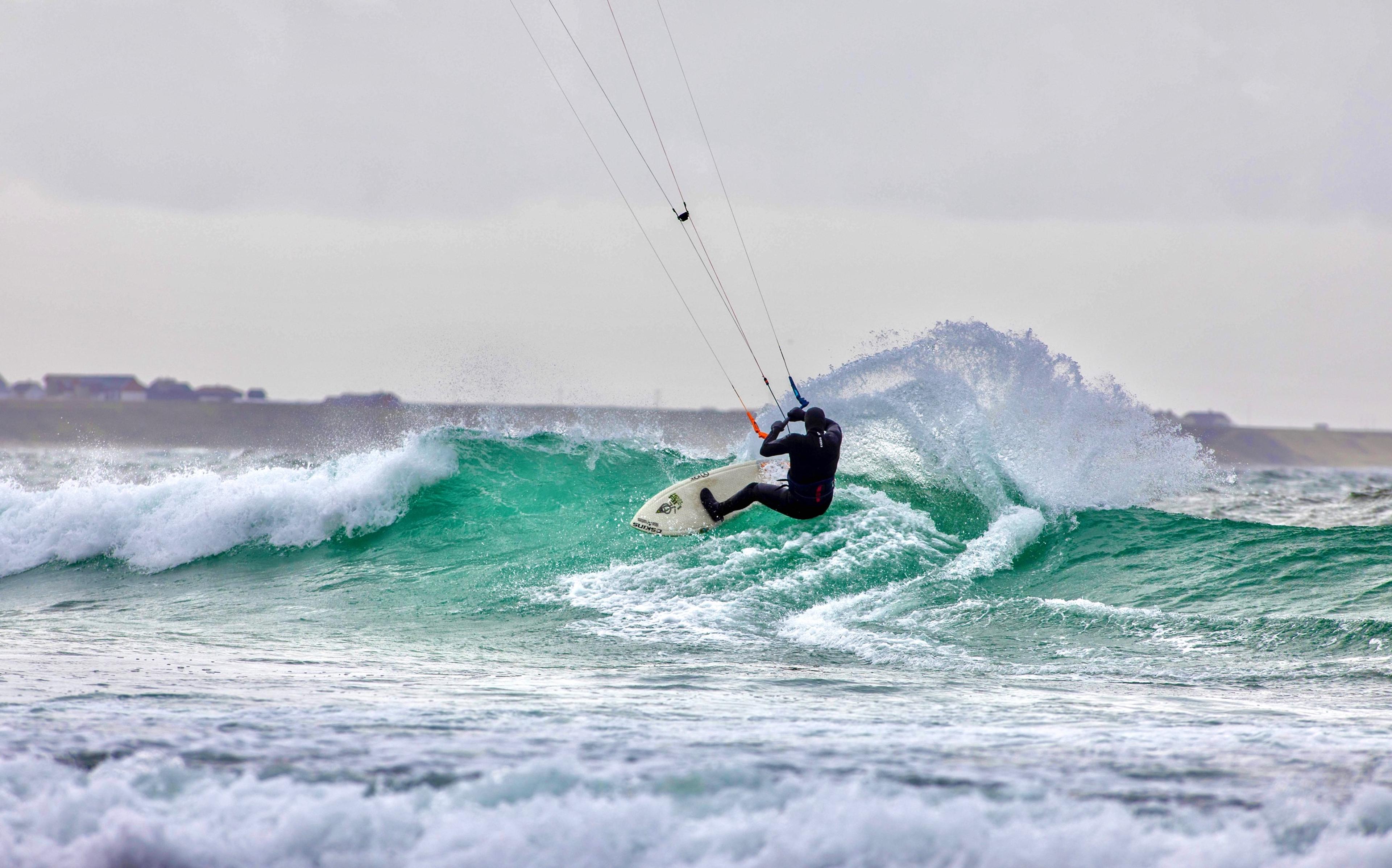 A person kiting on a wave in Fjord Norway.