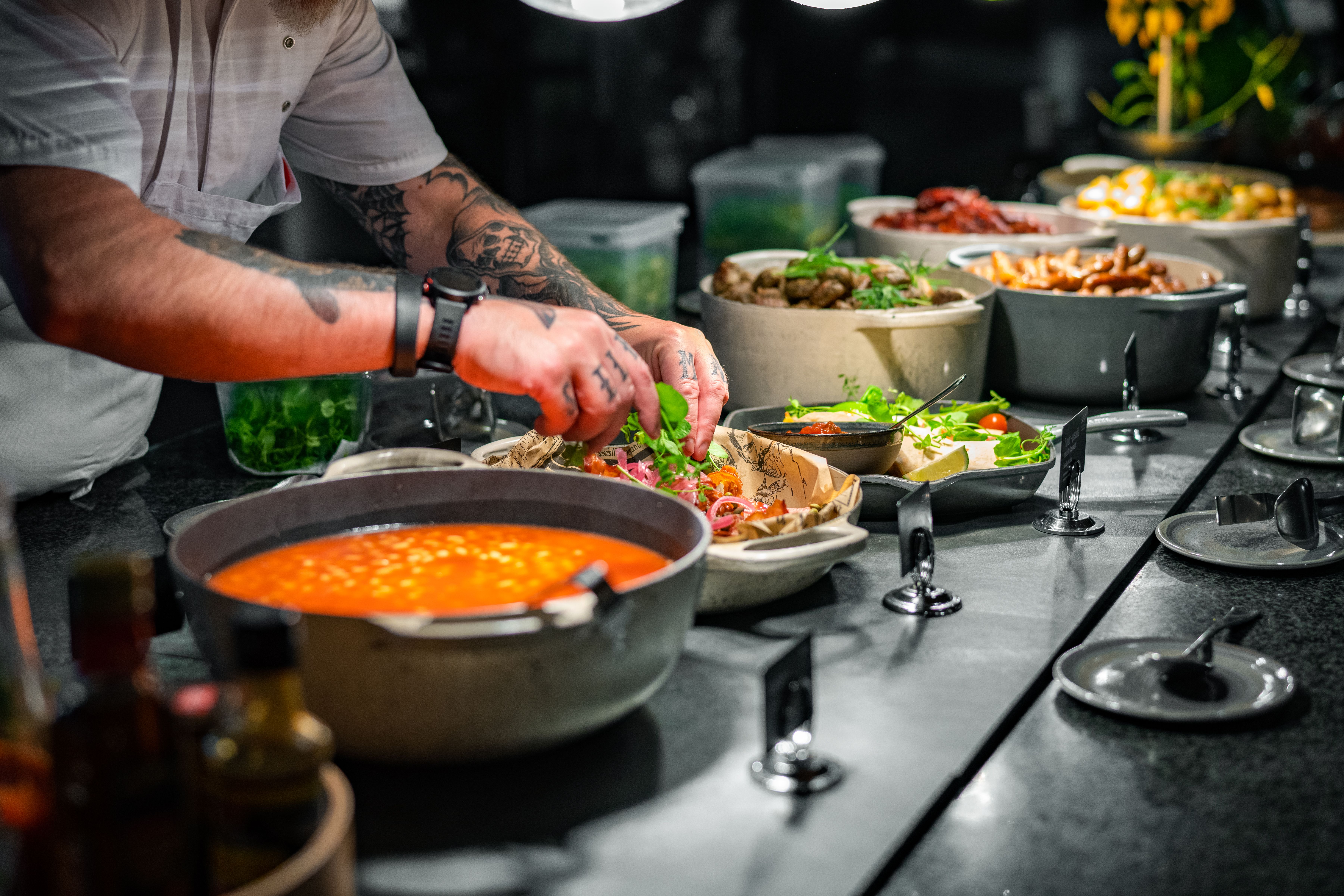 A chef preparing breakfast buffet