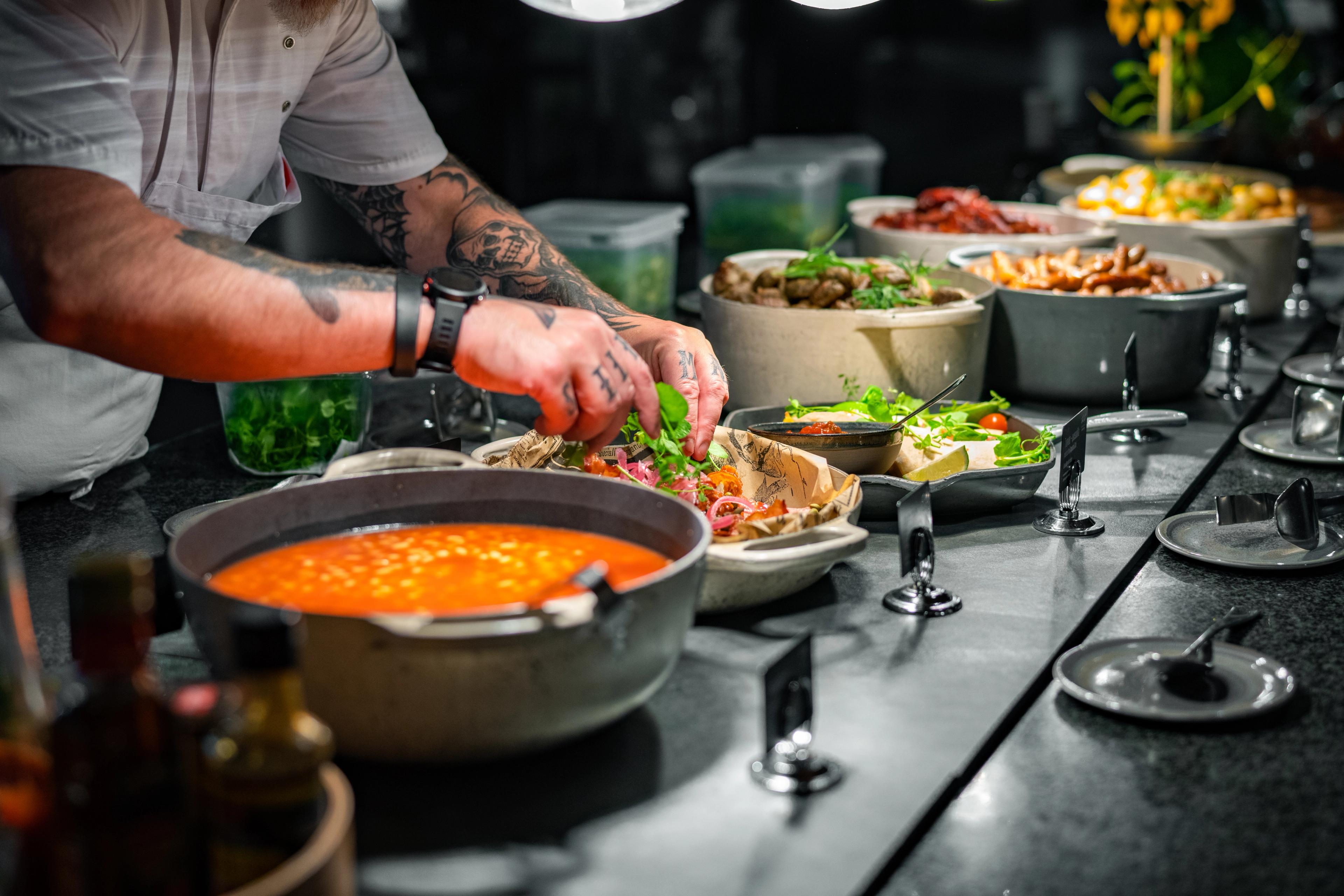 A chef preparing breakfast buffet