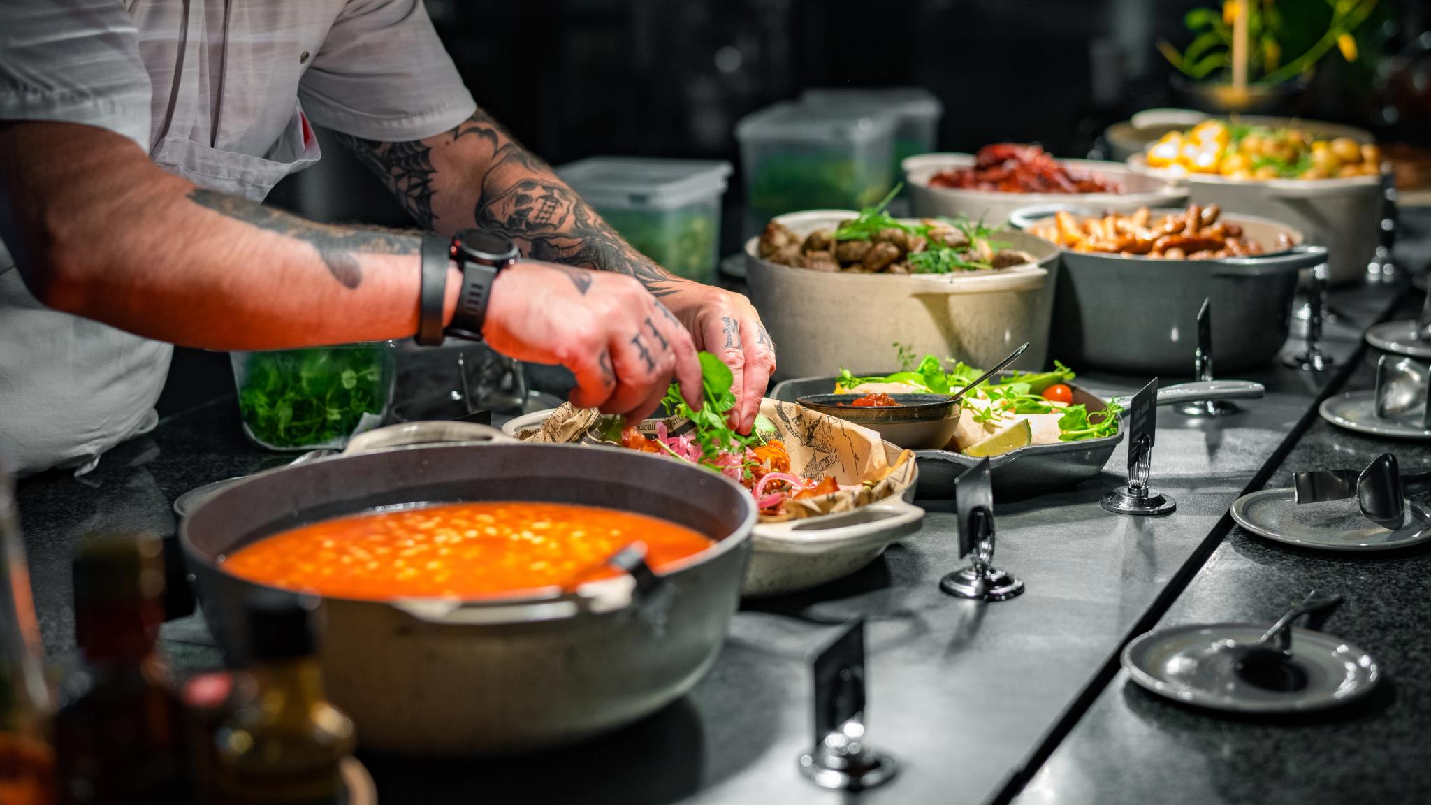 A chef preparing breakfast buffet