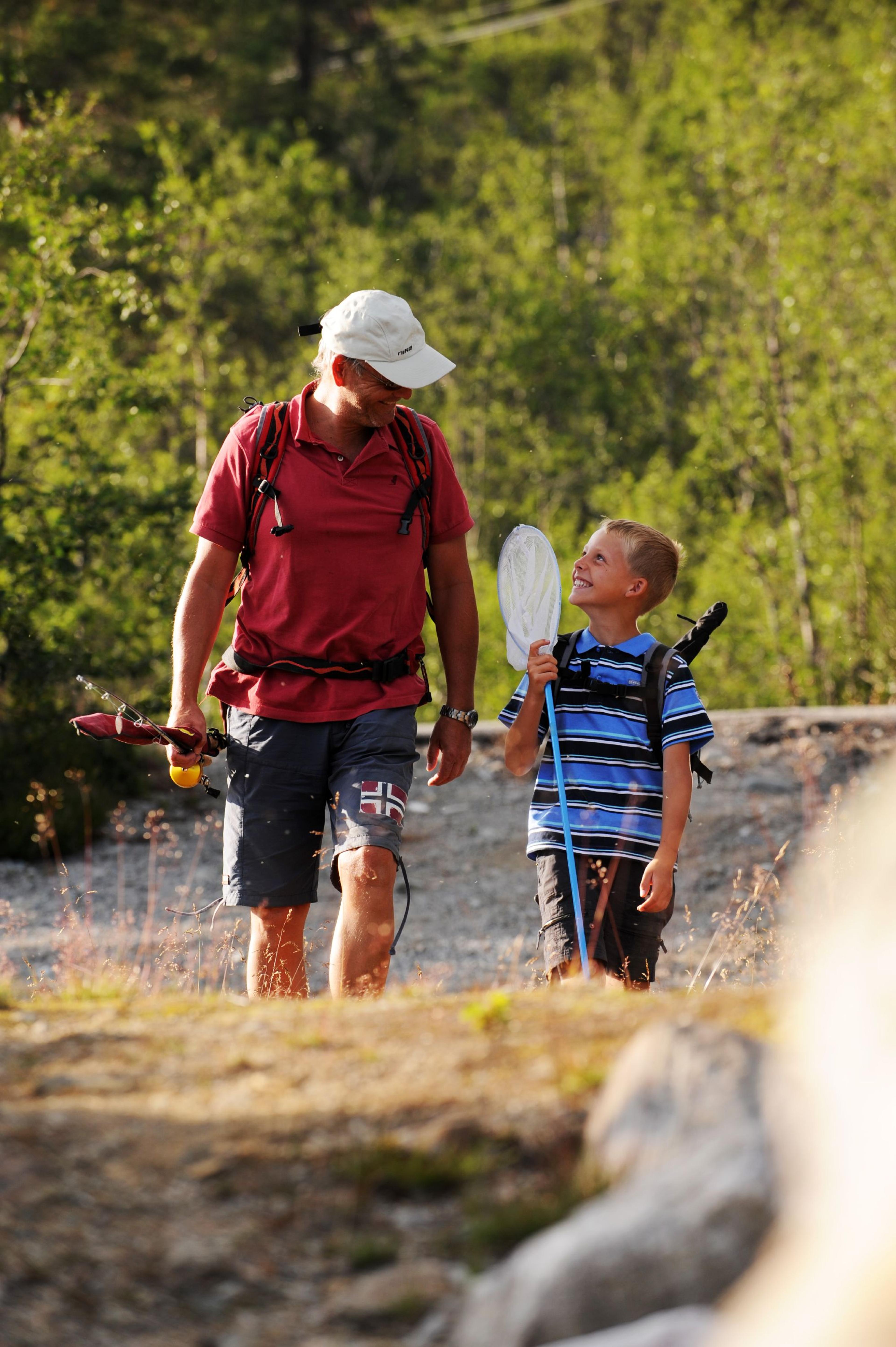 A boy and his father on a fishing trip at Hovden in Setesdal, Southern Norway