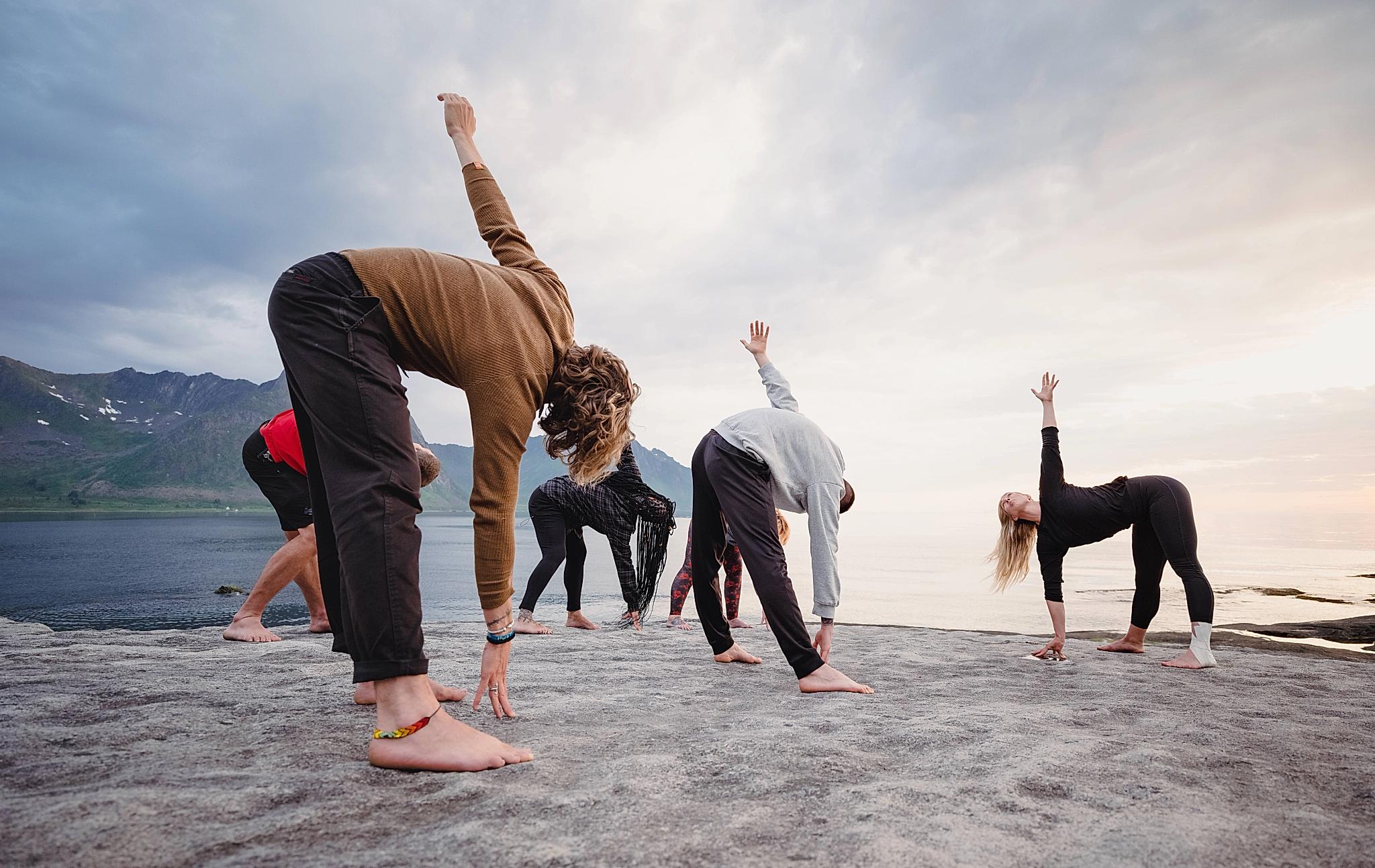 People doing yoga in the nature in Senja, Northern Norway.