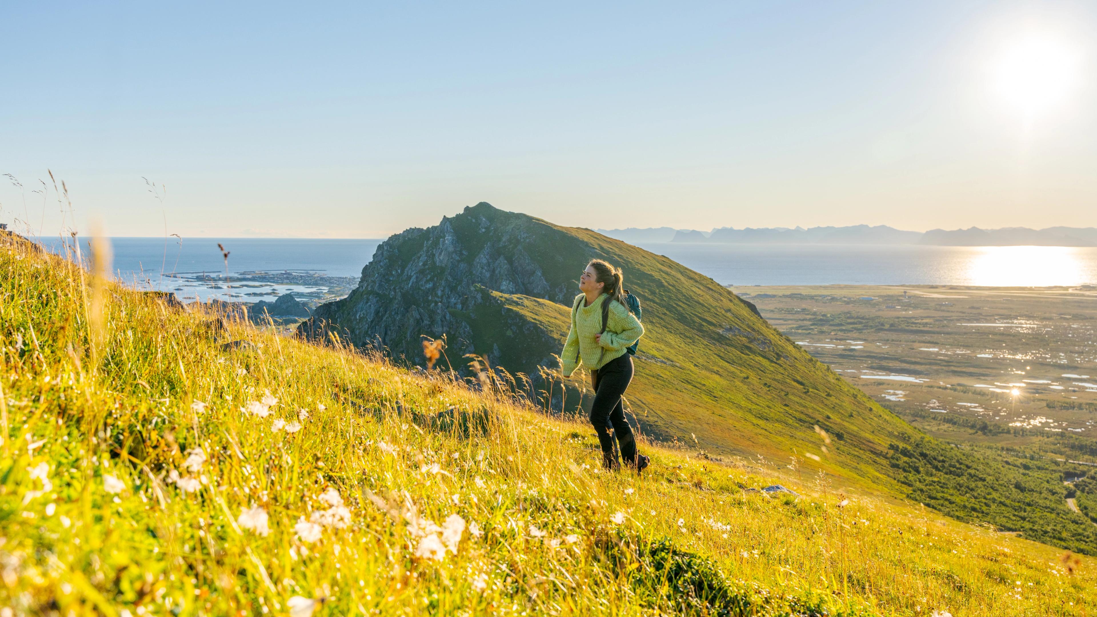 Woman hiking in the sun in Vesterålen, Northern Norway