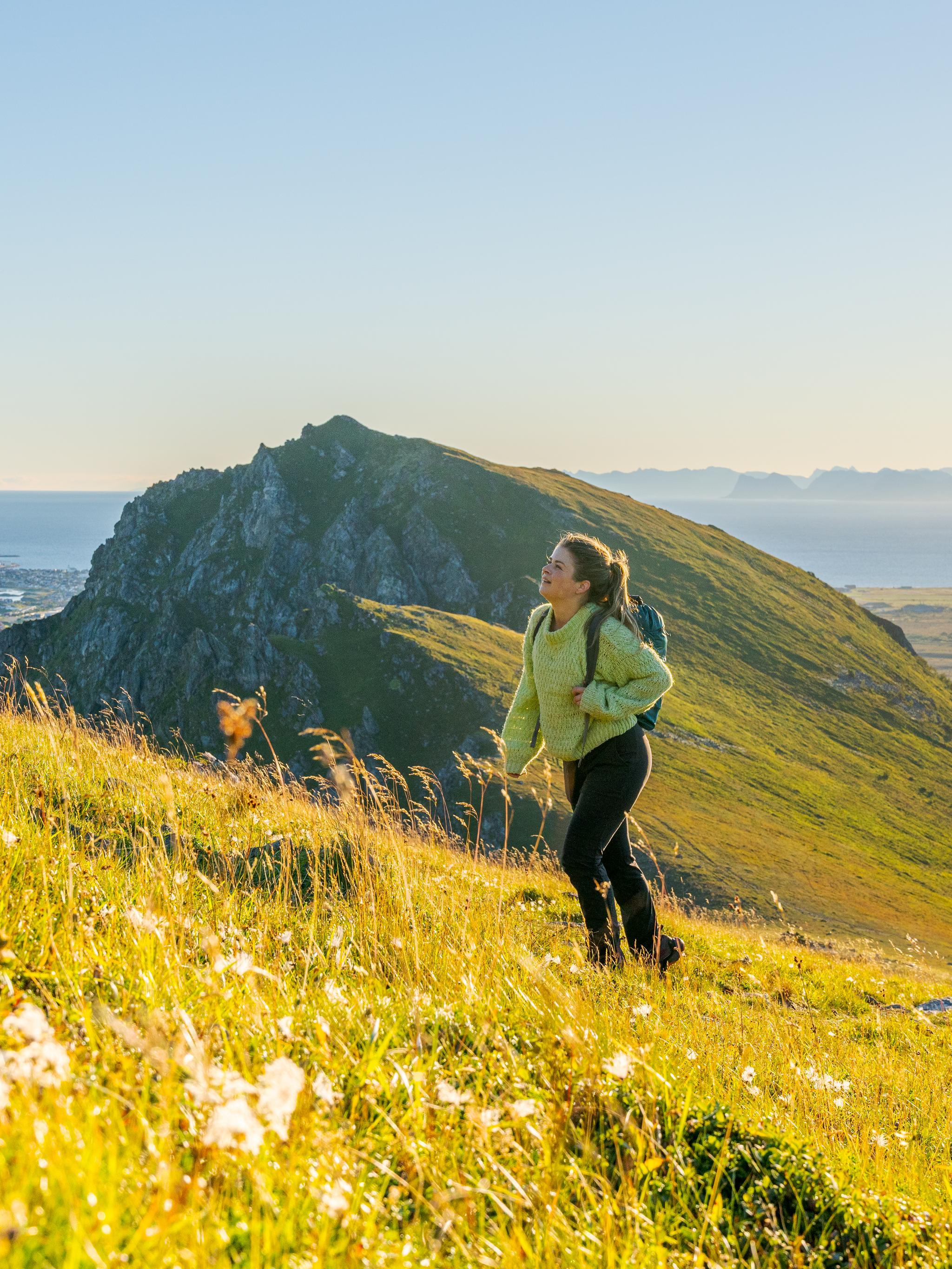 Woman hiking in the sun in Vesterålen, Northern Norway