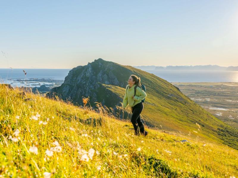 Woman hiking in the sun in Vesterålen, Northern Norway