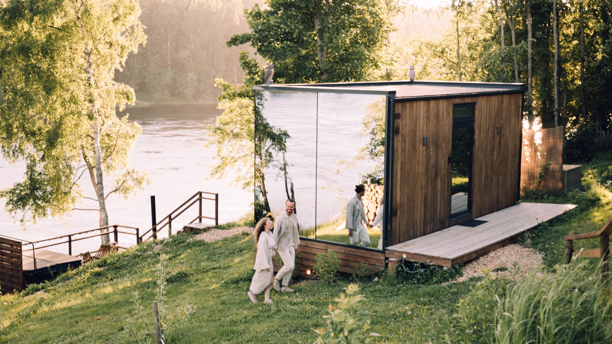 A couple staying at WonderInn Riverside by Huser Farm in Fenstad