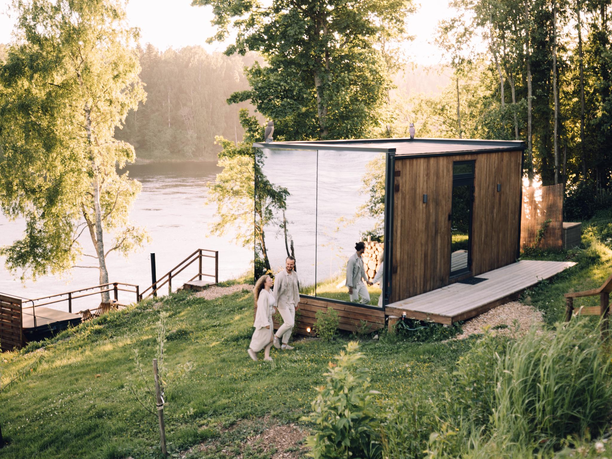 A couple staying at WonderInn Riverside by Huser Farm in Fenstad