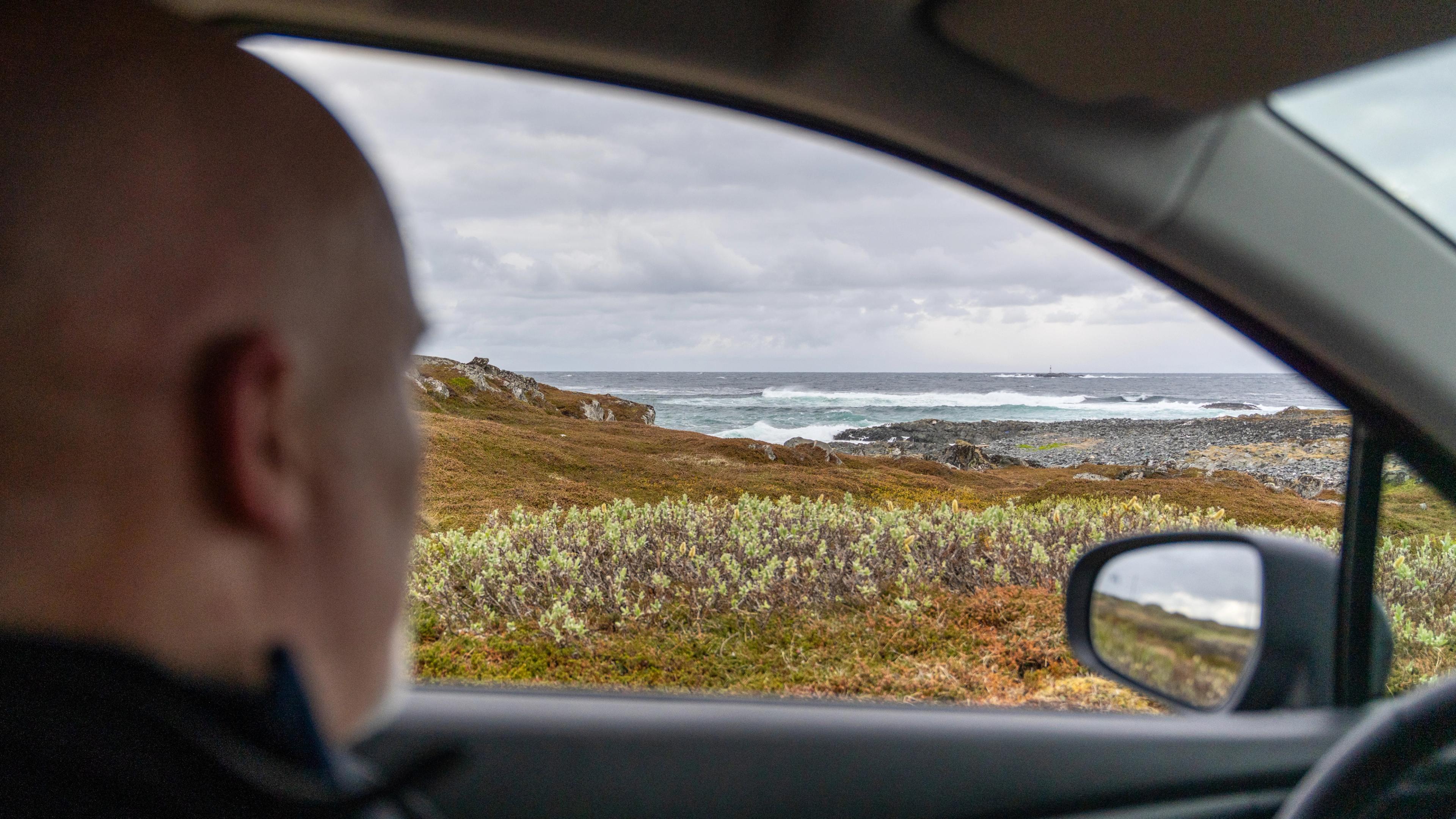 A man in the car along the Scenic Route Varanger, Northern Norway.
