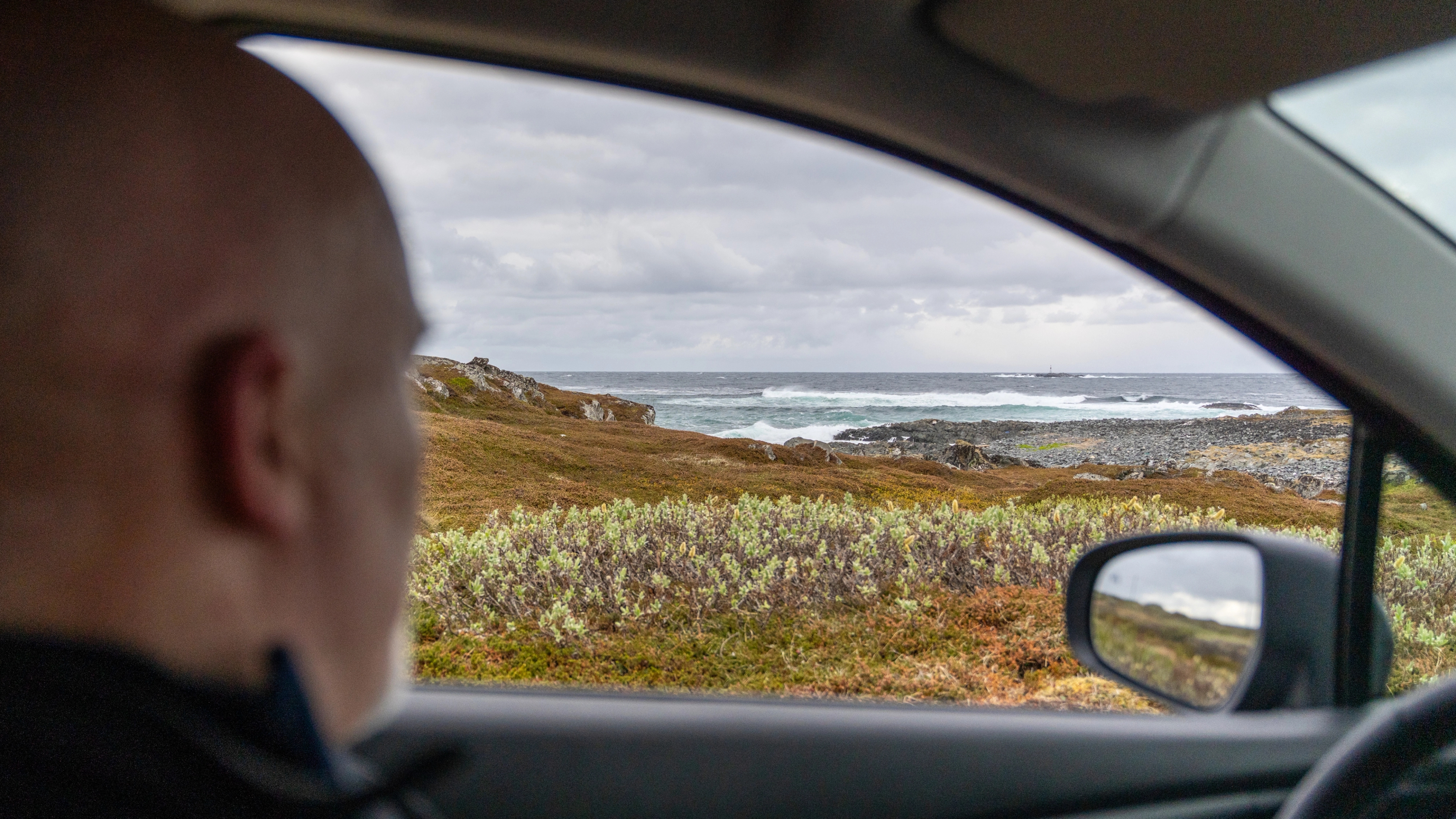 A man in the car along the Scenic Route Varanger, Northern Norway.