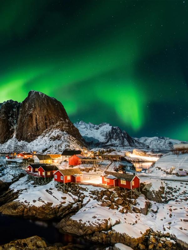 A view of Lofoten underneath the Northern Lights.