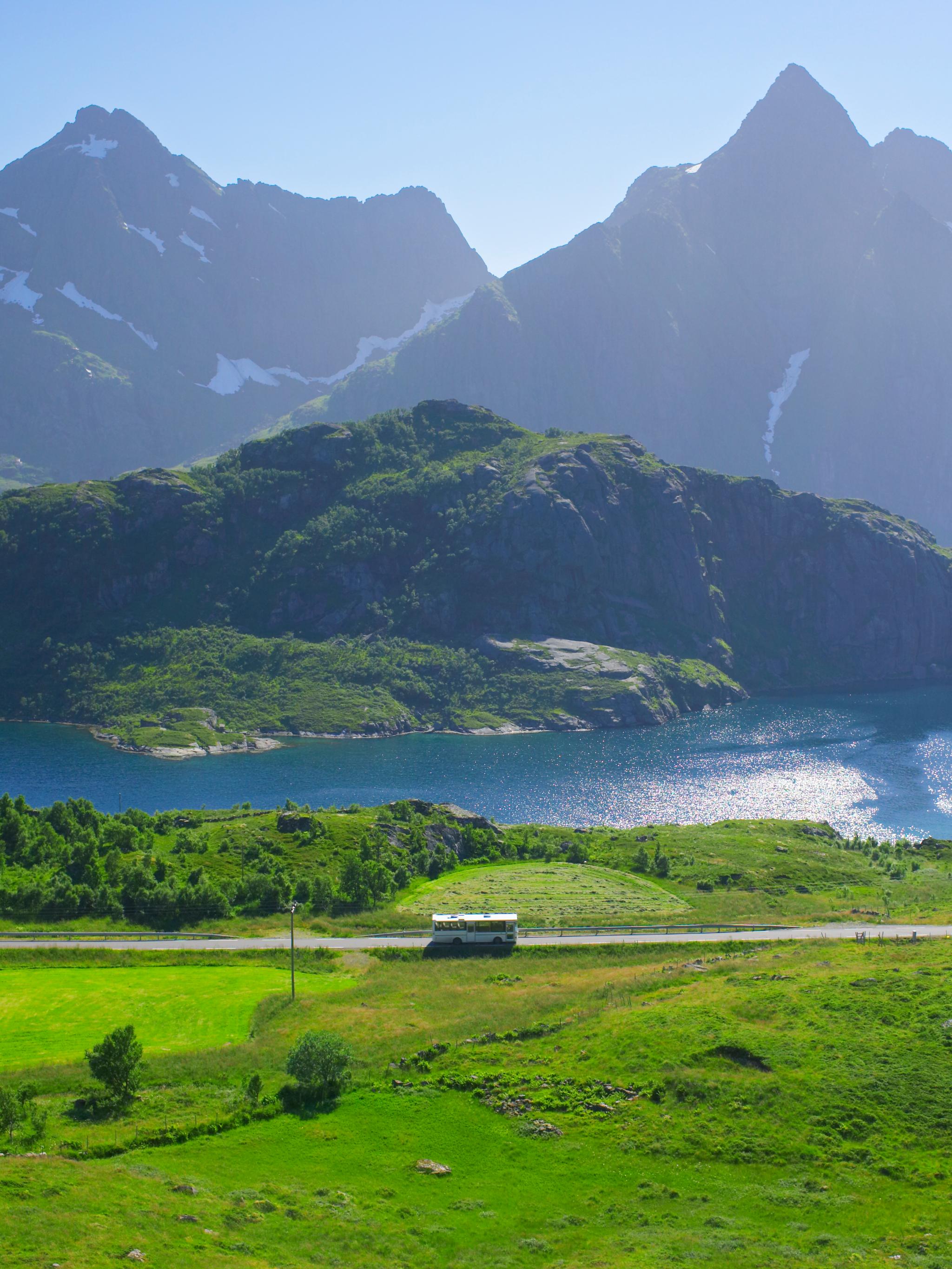A bus in the summer landscape in Lofoten, Northern Norway.