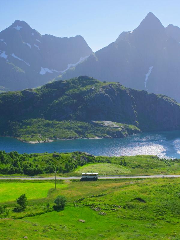 A bus in the summer landscape in Lofoten, Northern Norway.