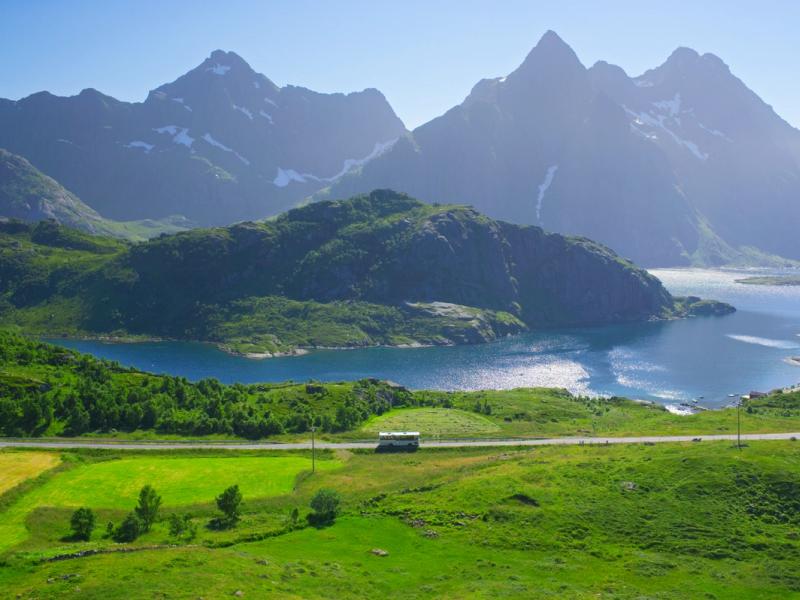 A bus in the summer landscape in Lofoten, Northern Norway.