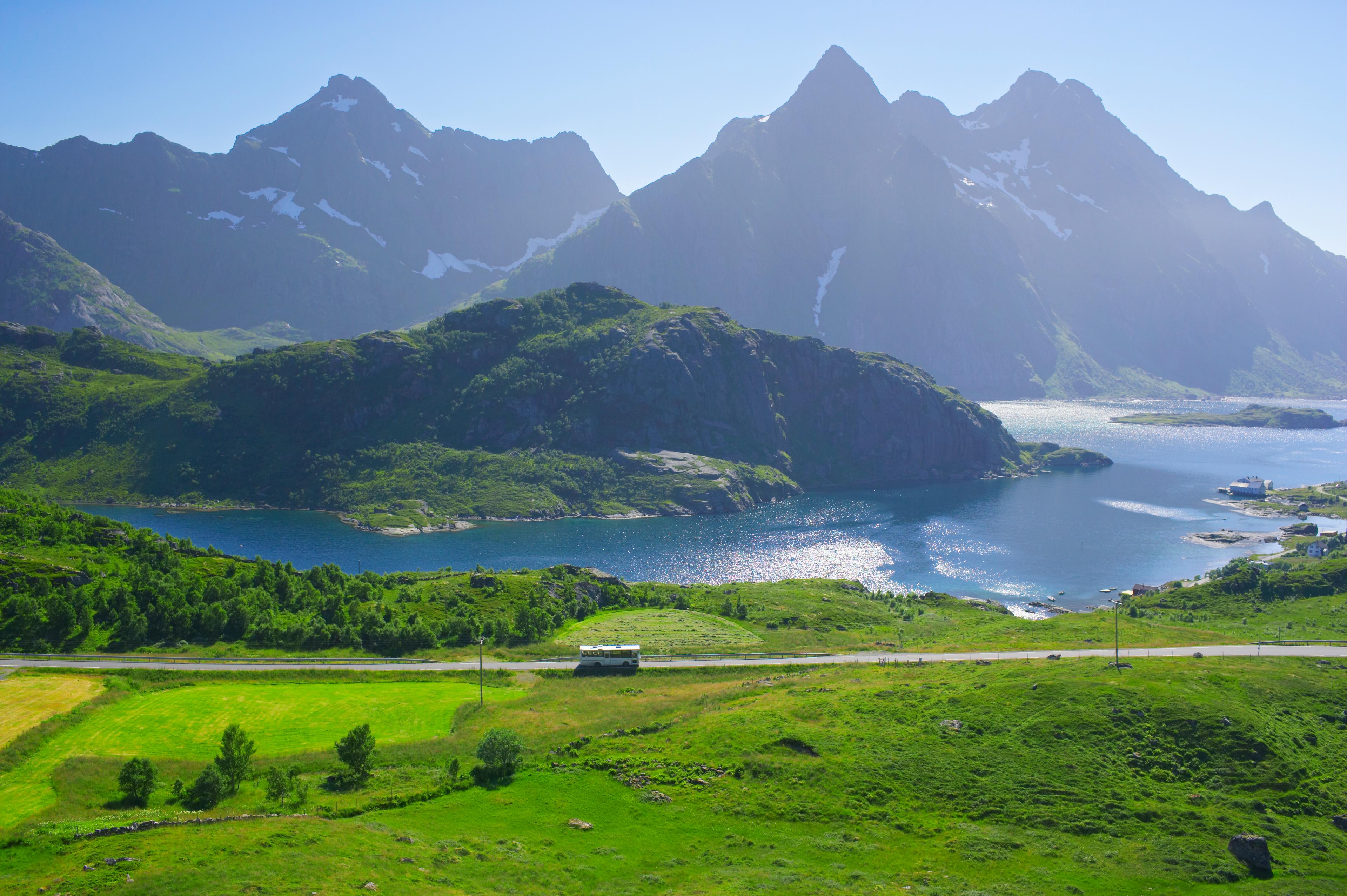 A bus in the summer landscape in Lofoten, Northern Norway.