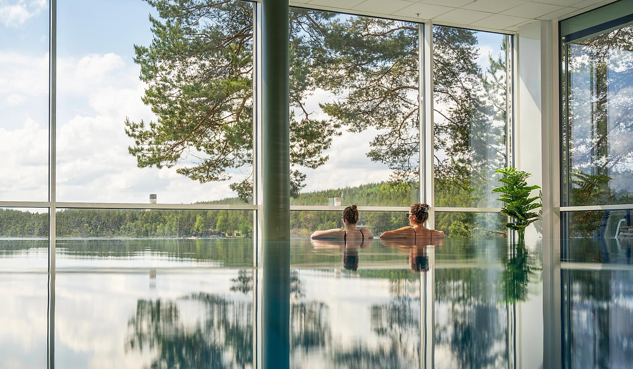 Women enjoying the view from the pool at Rømskog Spa & Resort