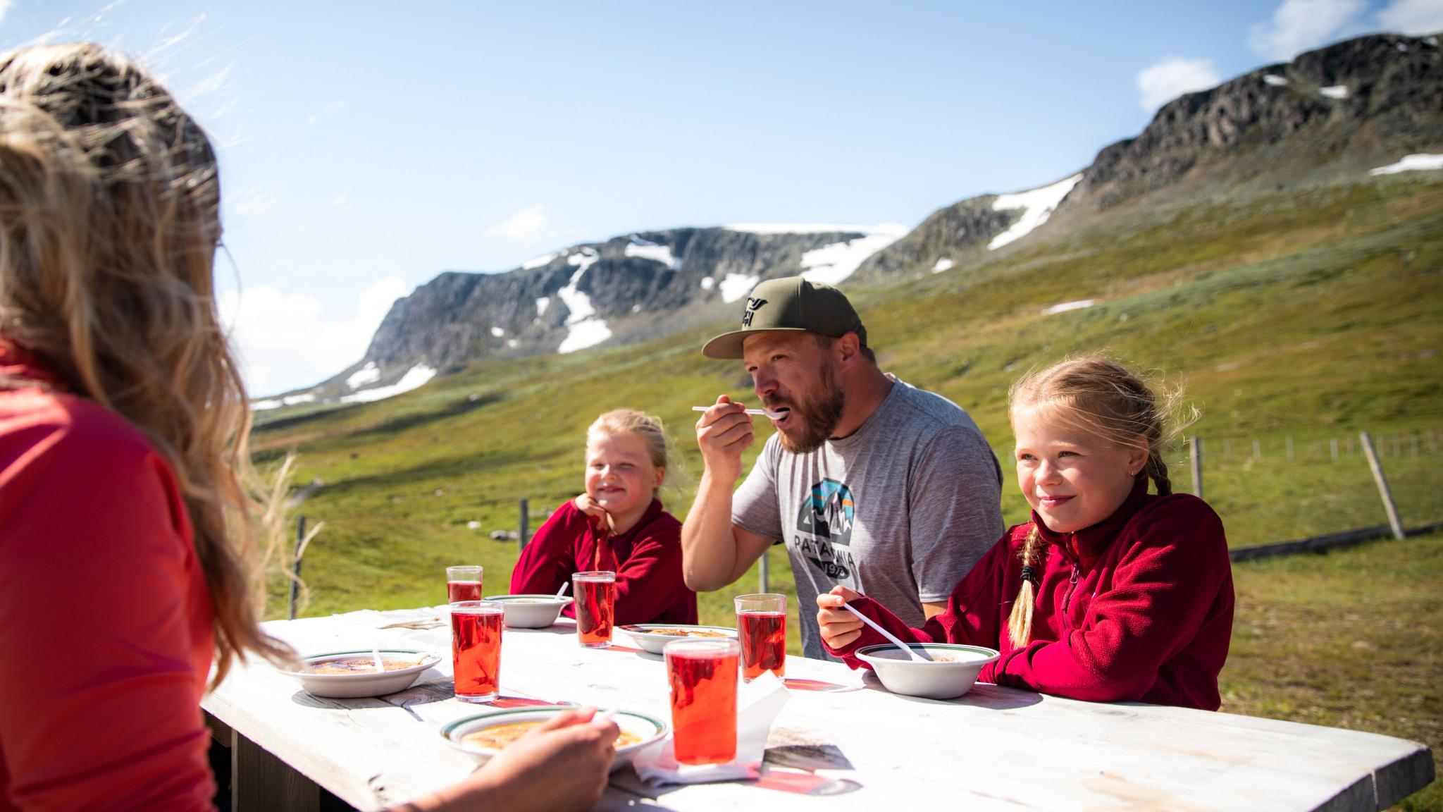 Family eating at Prestholtseter in Geilo, Eastern Norway