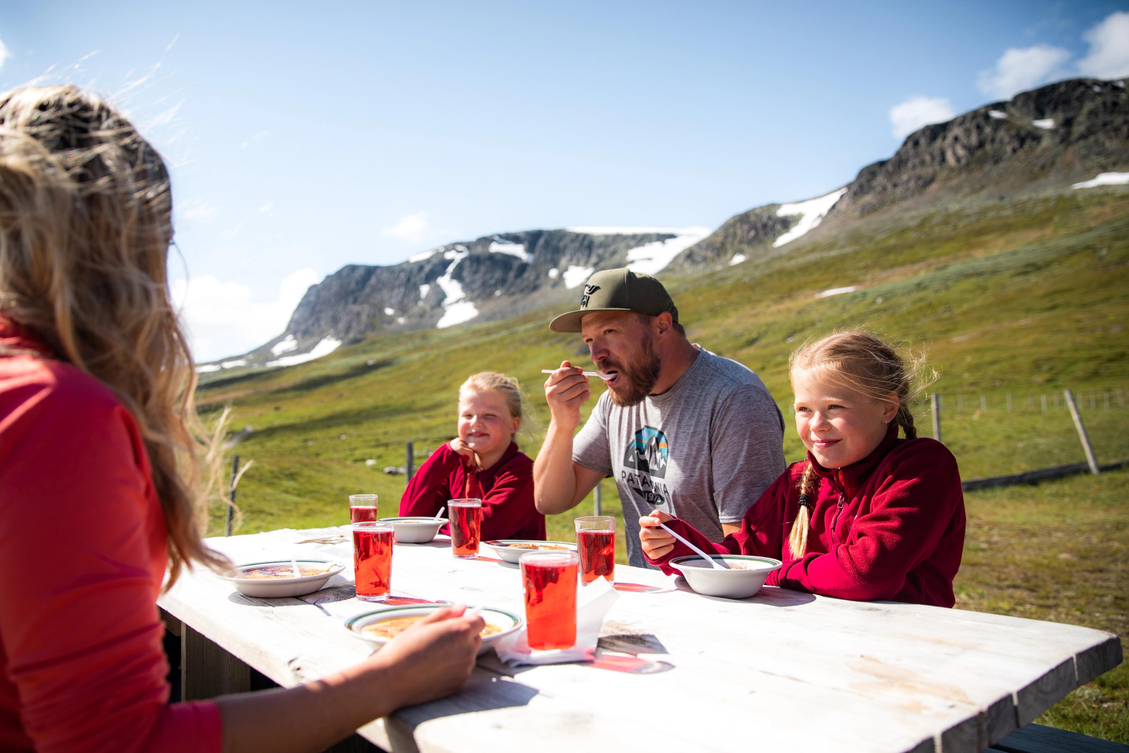 Family eating at Prestholtseter in Geilo, Eastern Norway