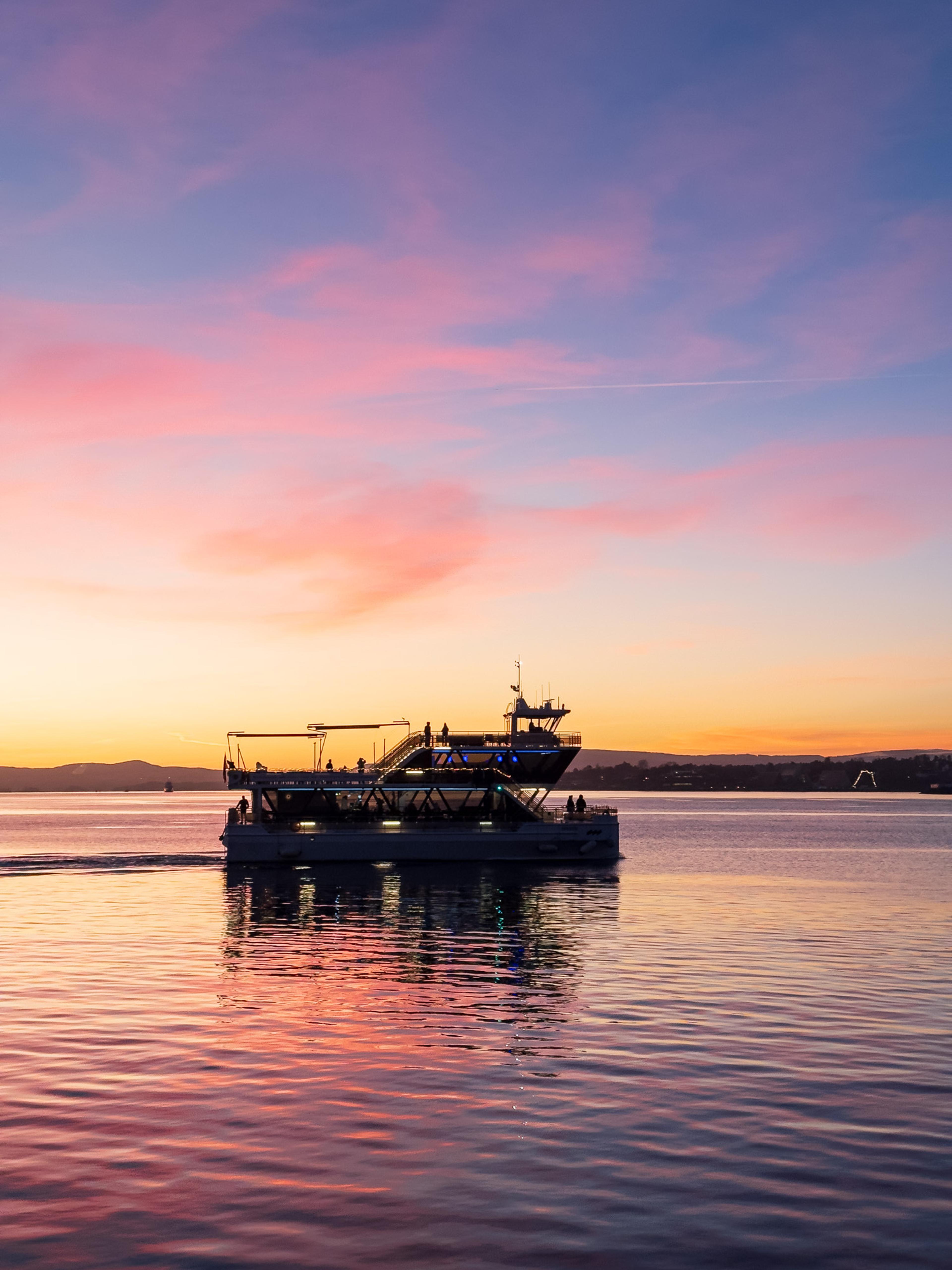 Brim Explorer catamaran on Stavanger archipelago at sunset