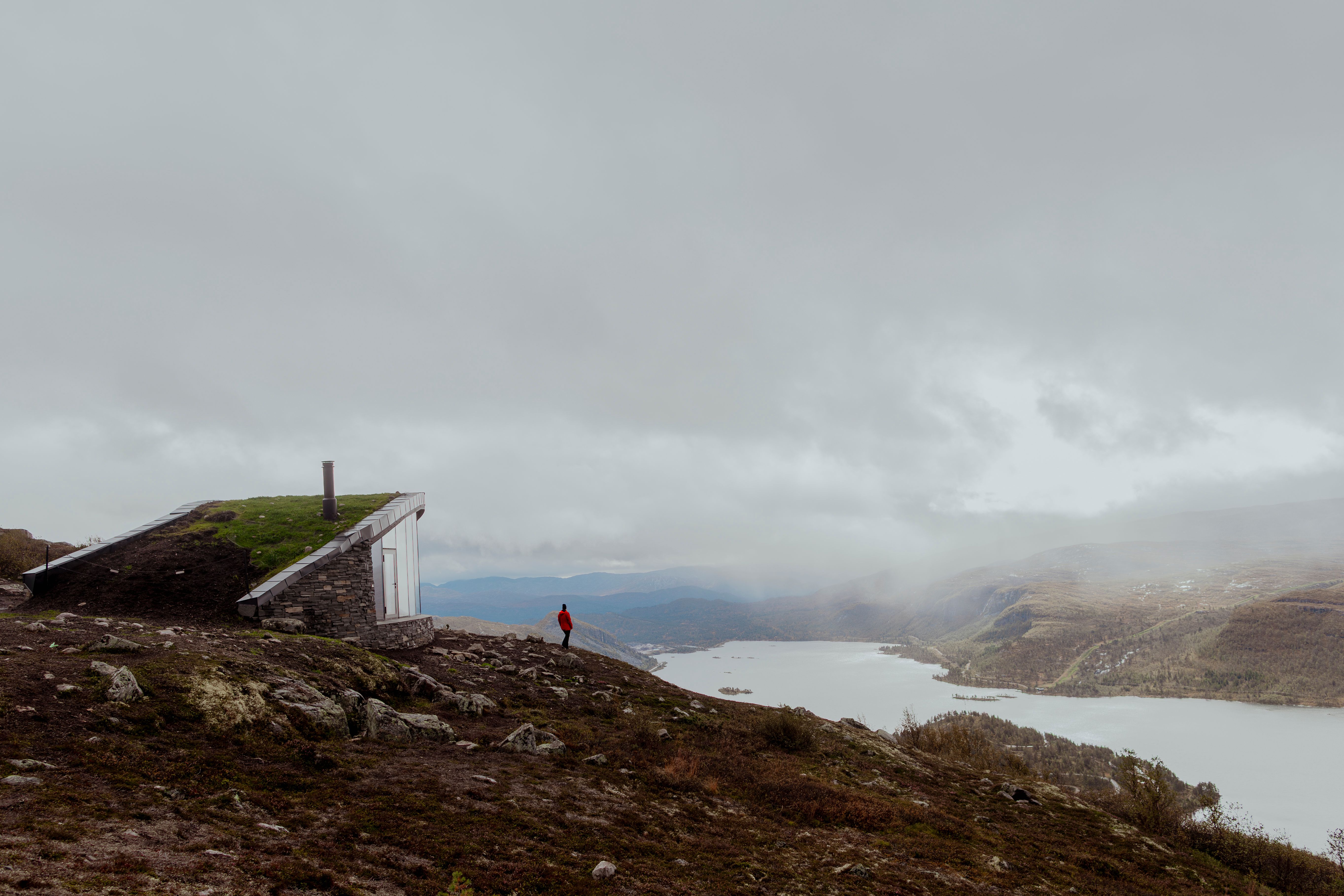 A person outside the Day Trip Cabin at Hovdenuten in Hovden