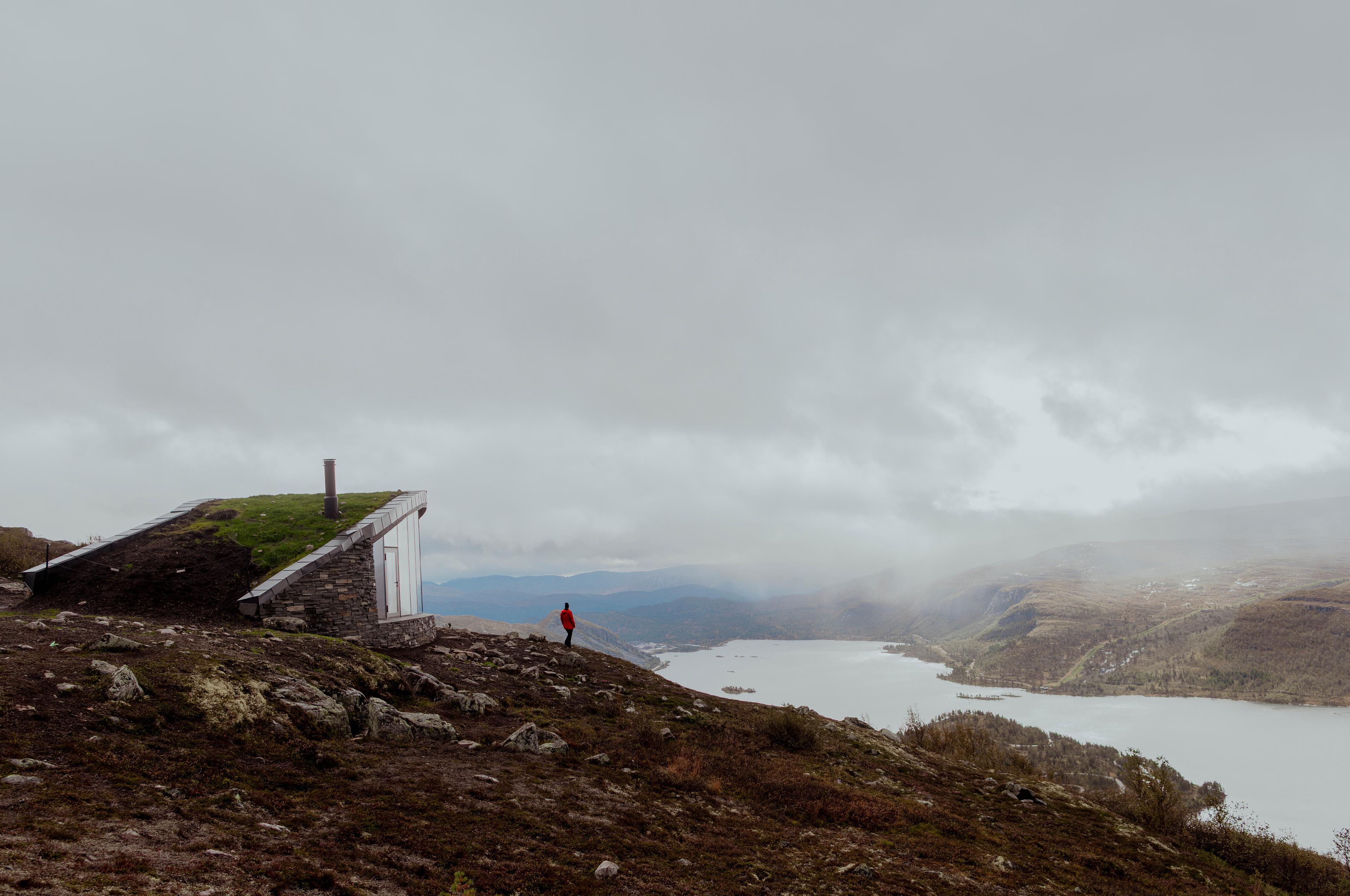 A person outside the Day Trip Cabin at Hovdenuten in Hovden