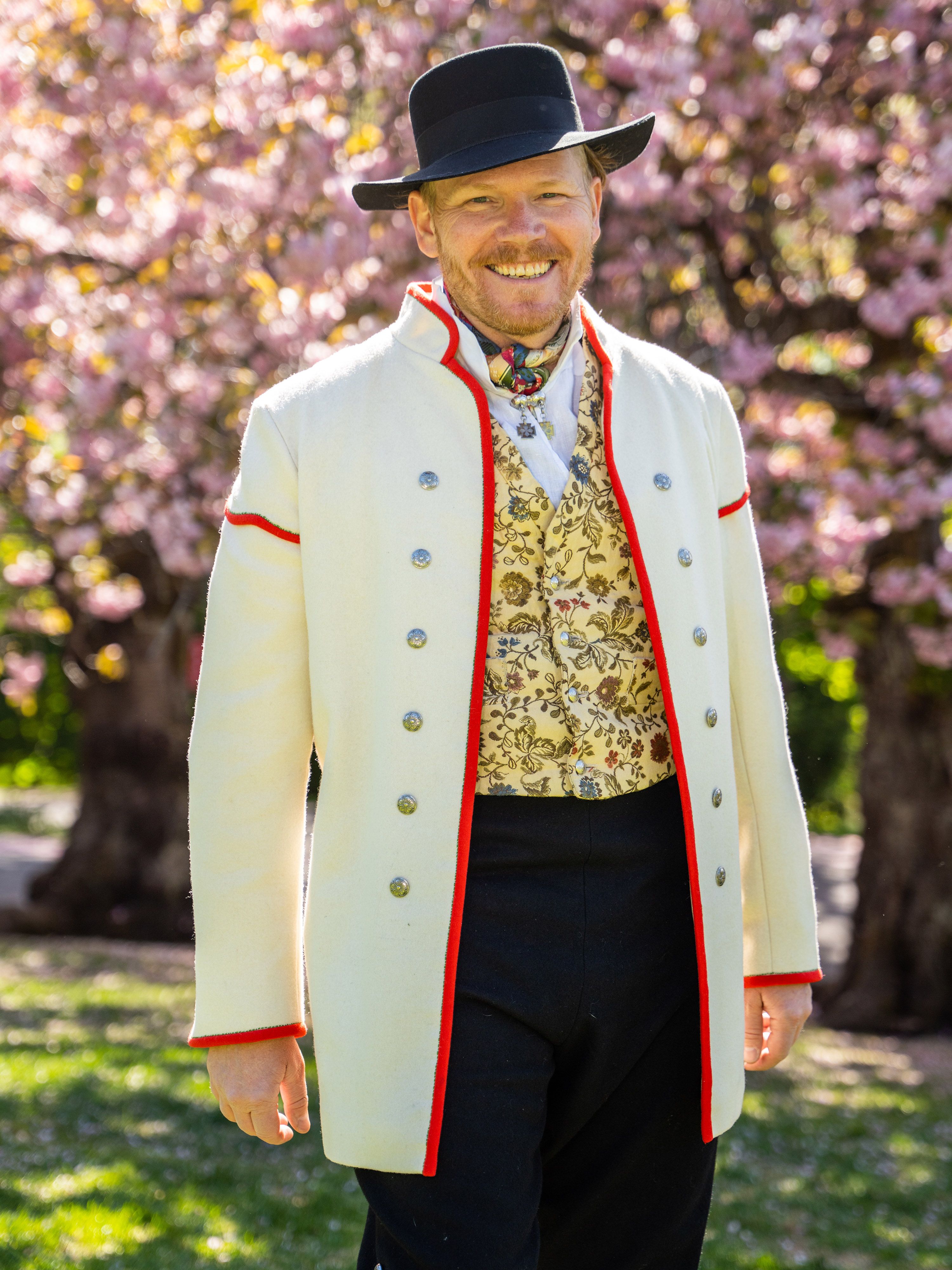 A man wearing Gudbradsdalen bunad, traditional costume