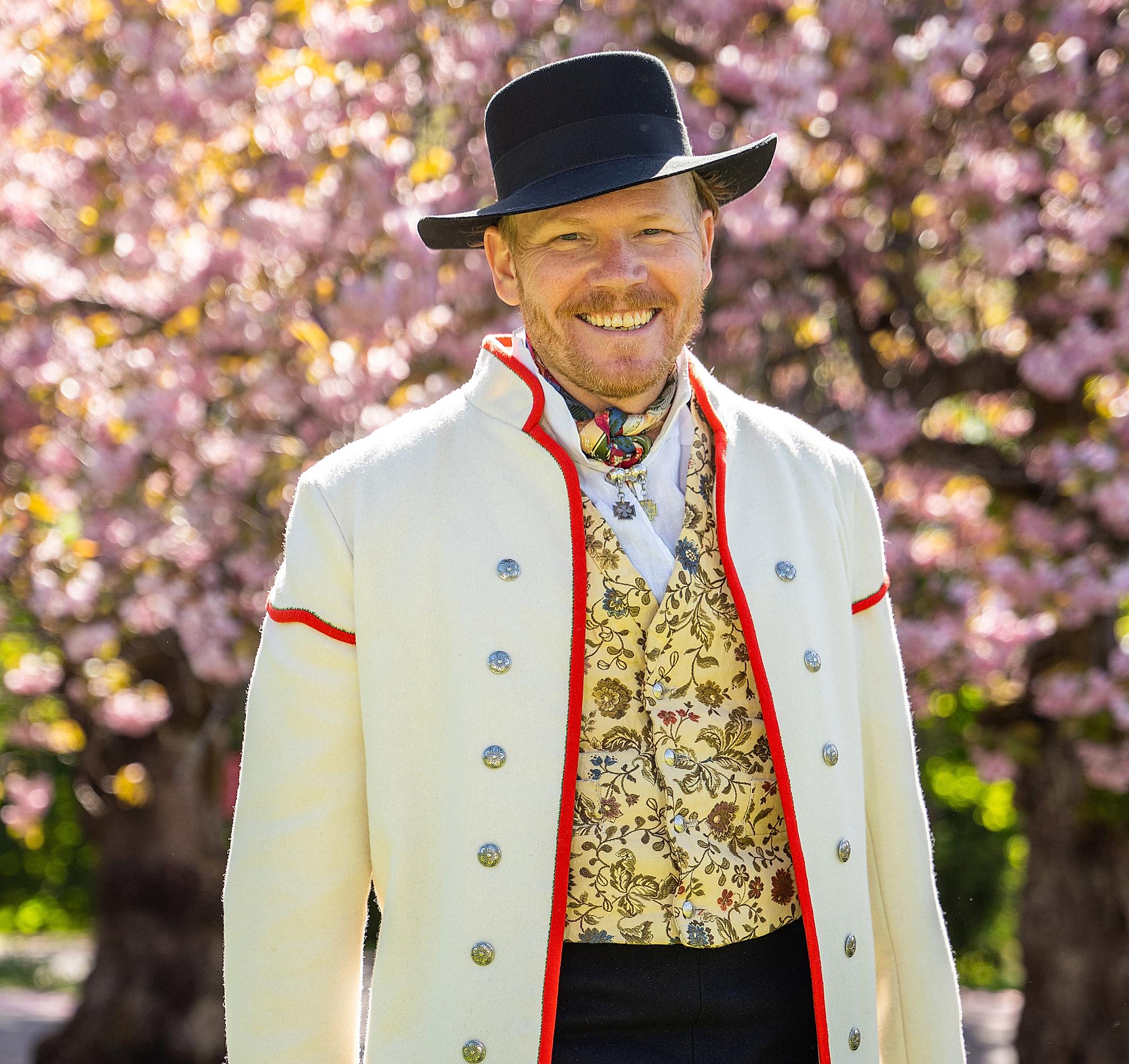 A man wearing Gudbradsdalen bunad, traditional costume