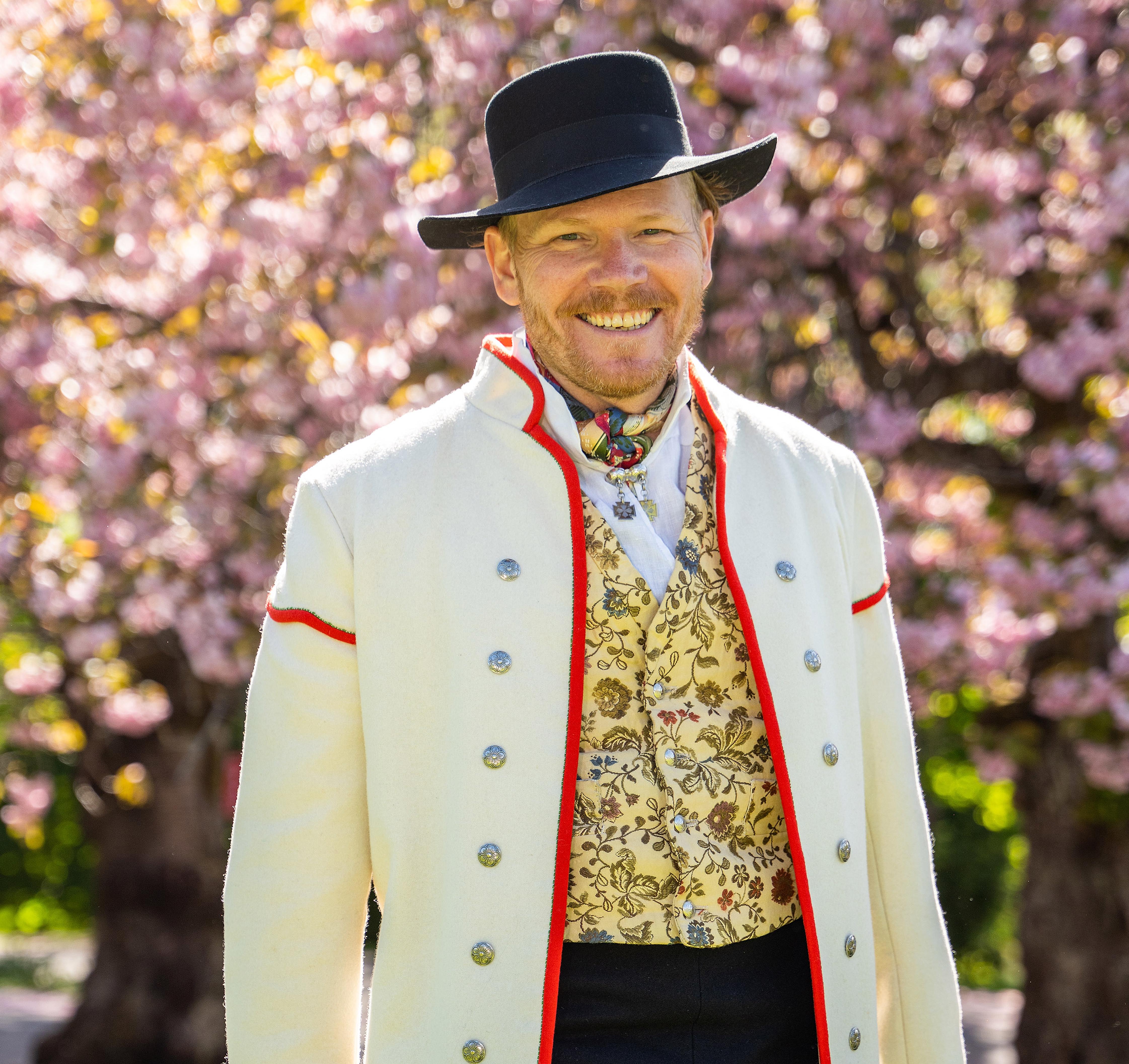 A man wearing Gudbradsdalen bunad, traditional costume