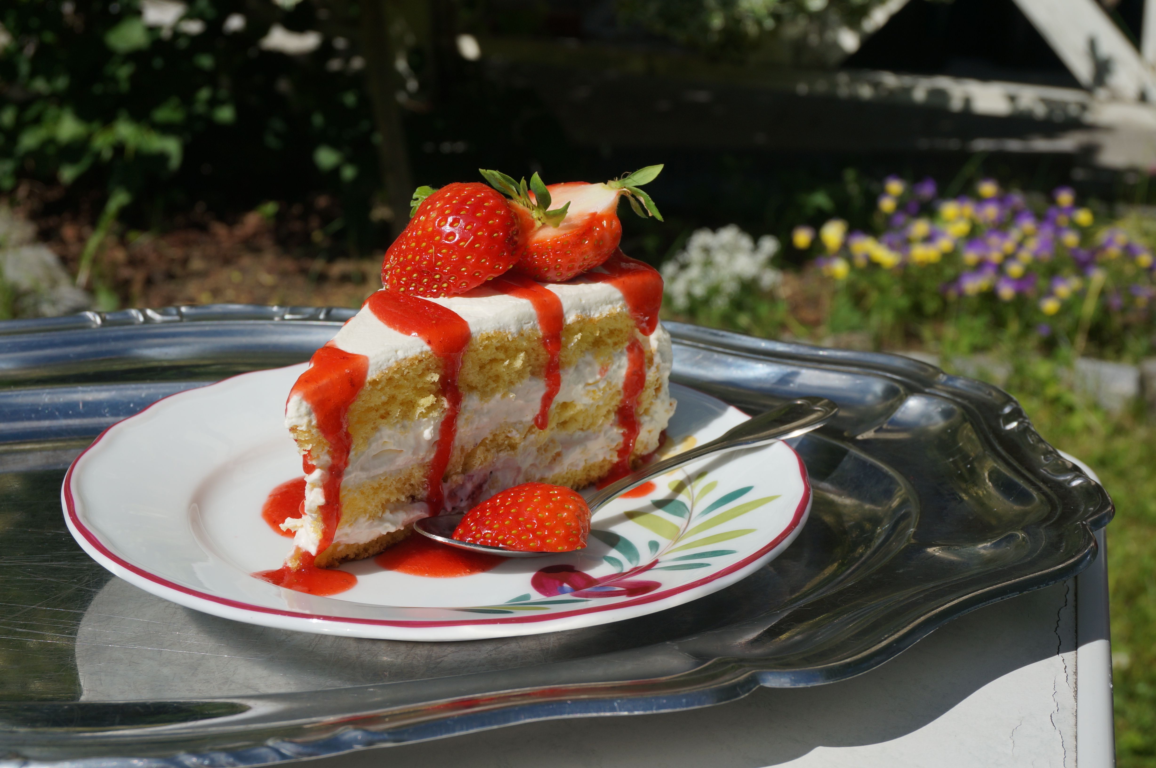 A cake topped with strawberries in the strawberry village Valldal in Fjord Norway