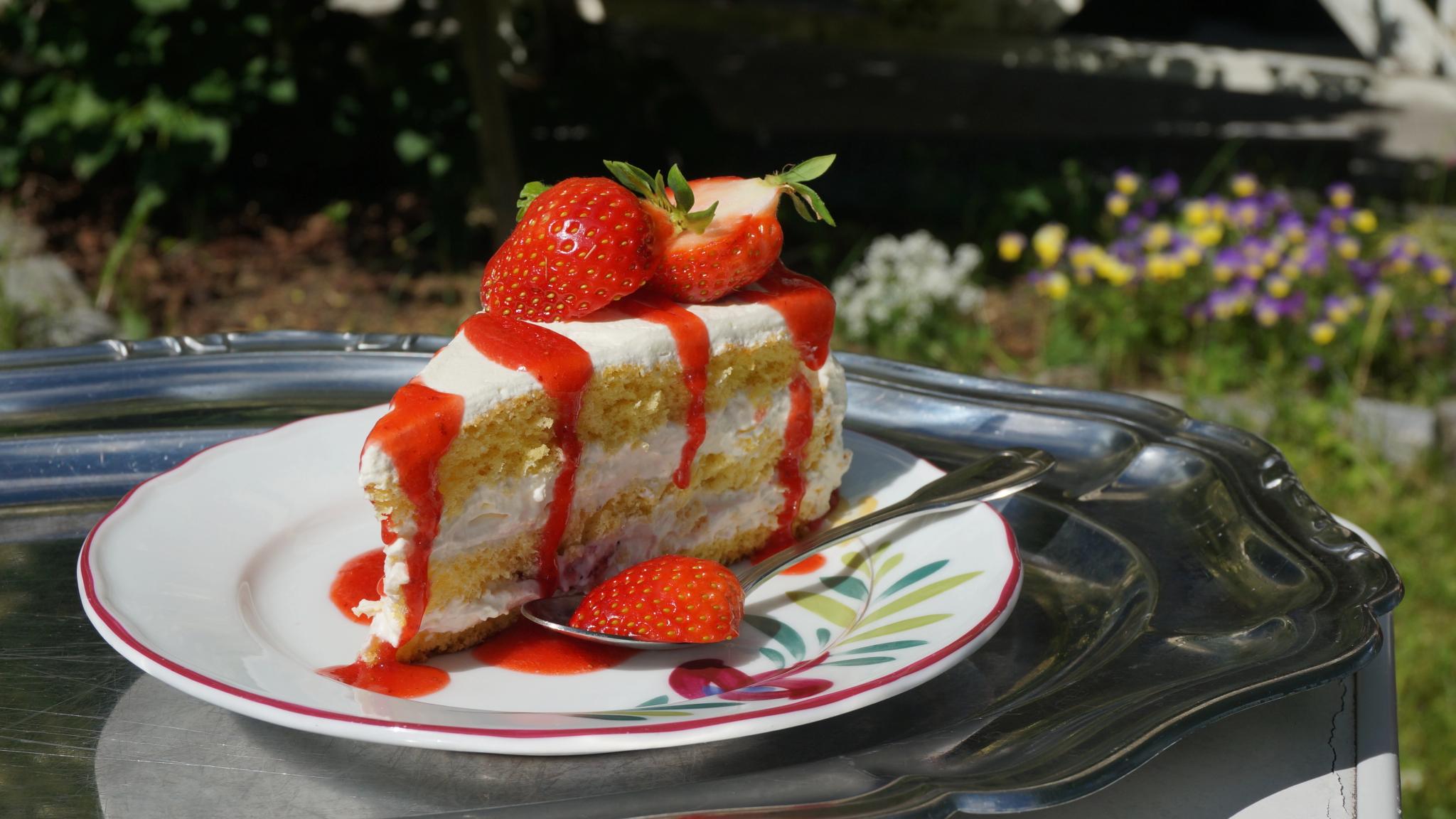 A cake topped with strawberries in the strawberry village Valldal in Fjord Norway