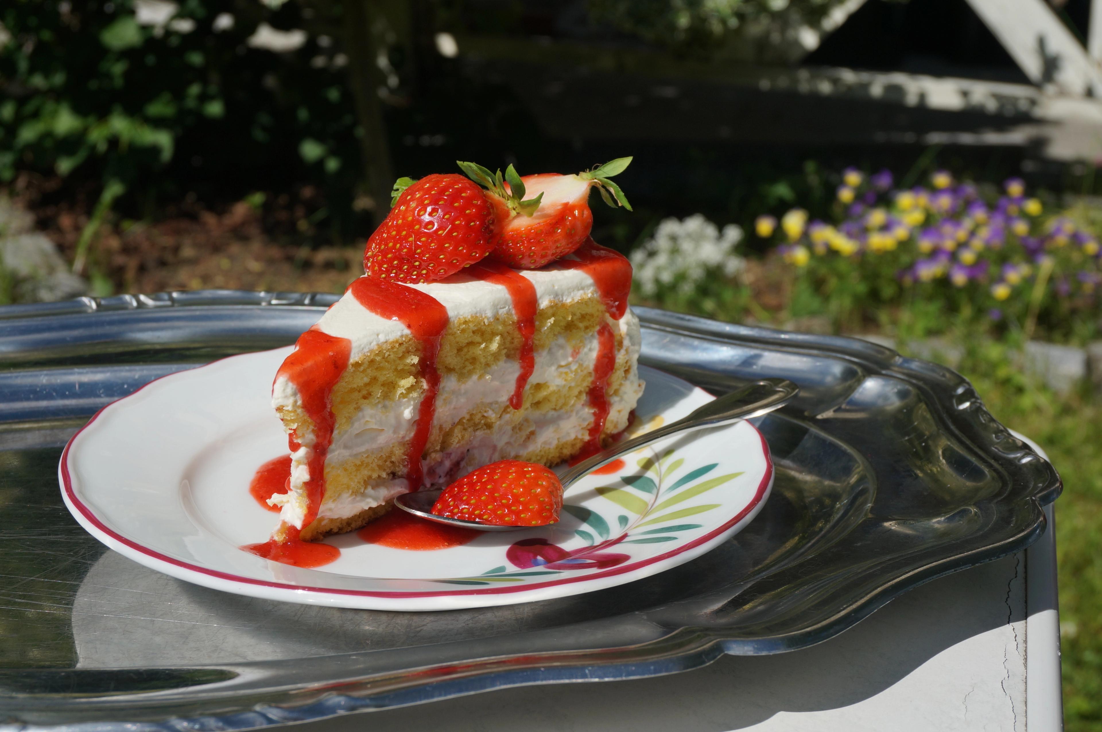A cake topped with strawberries in the strawberry village Valldal in Fjord Norway