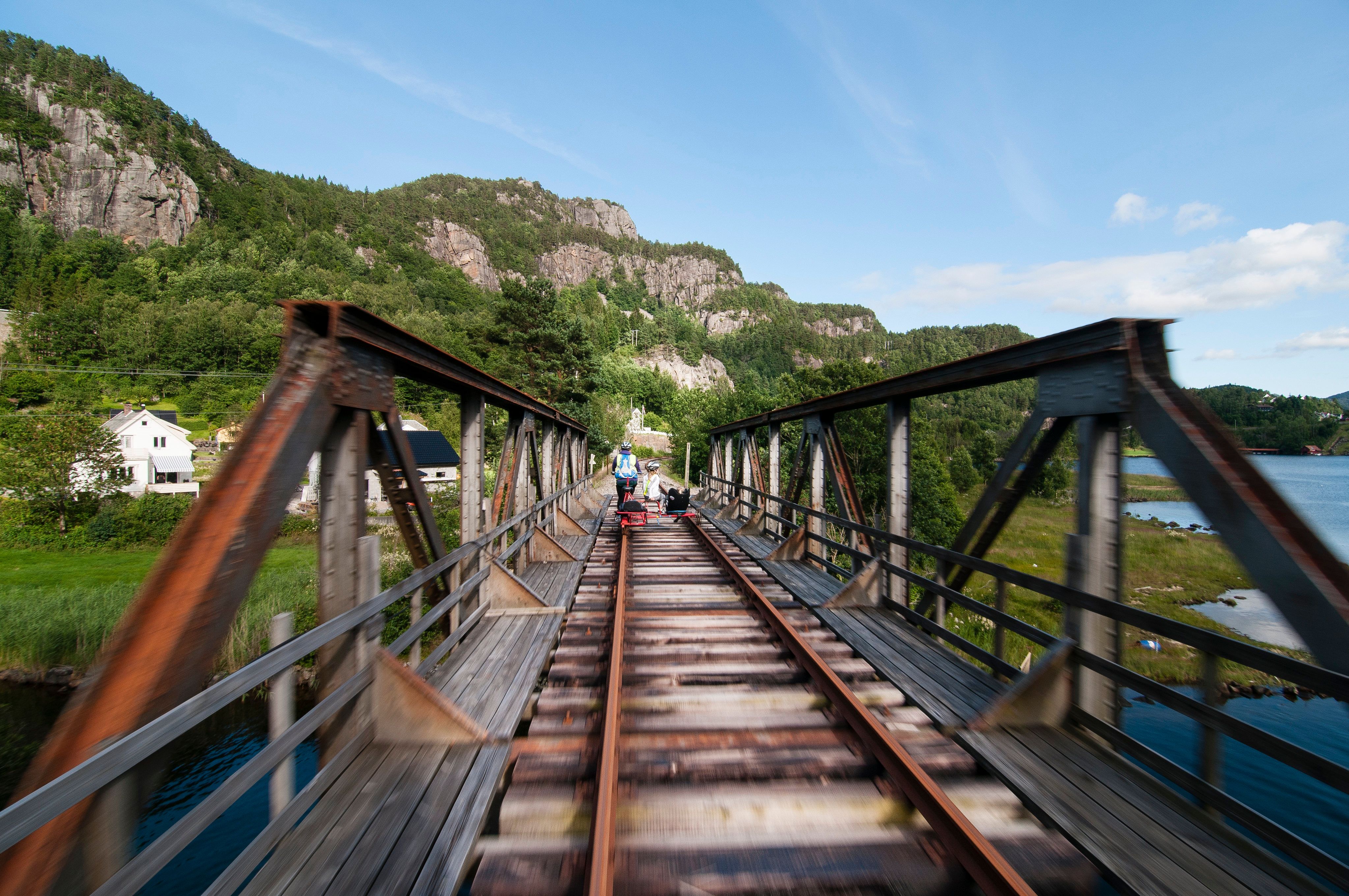 People riding a rail bike in Flekkefjord, Norway