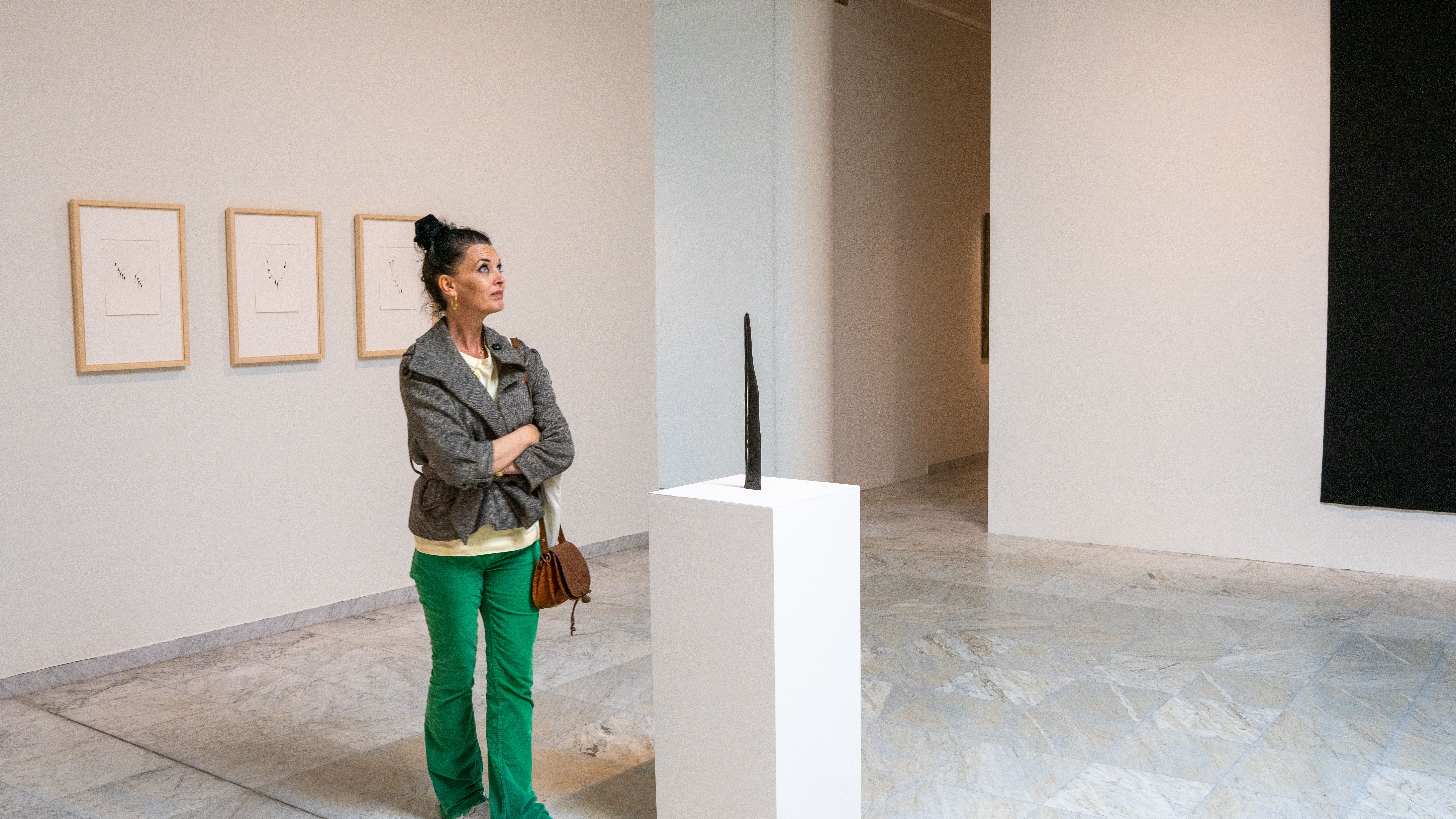 A woman looks at art at the Stavanger Kunstmuseum, Fjord Norway