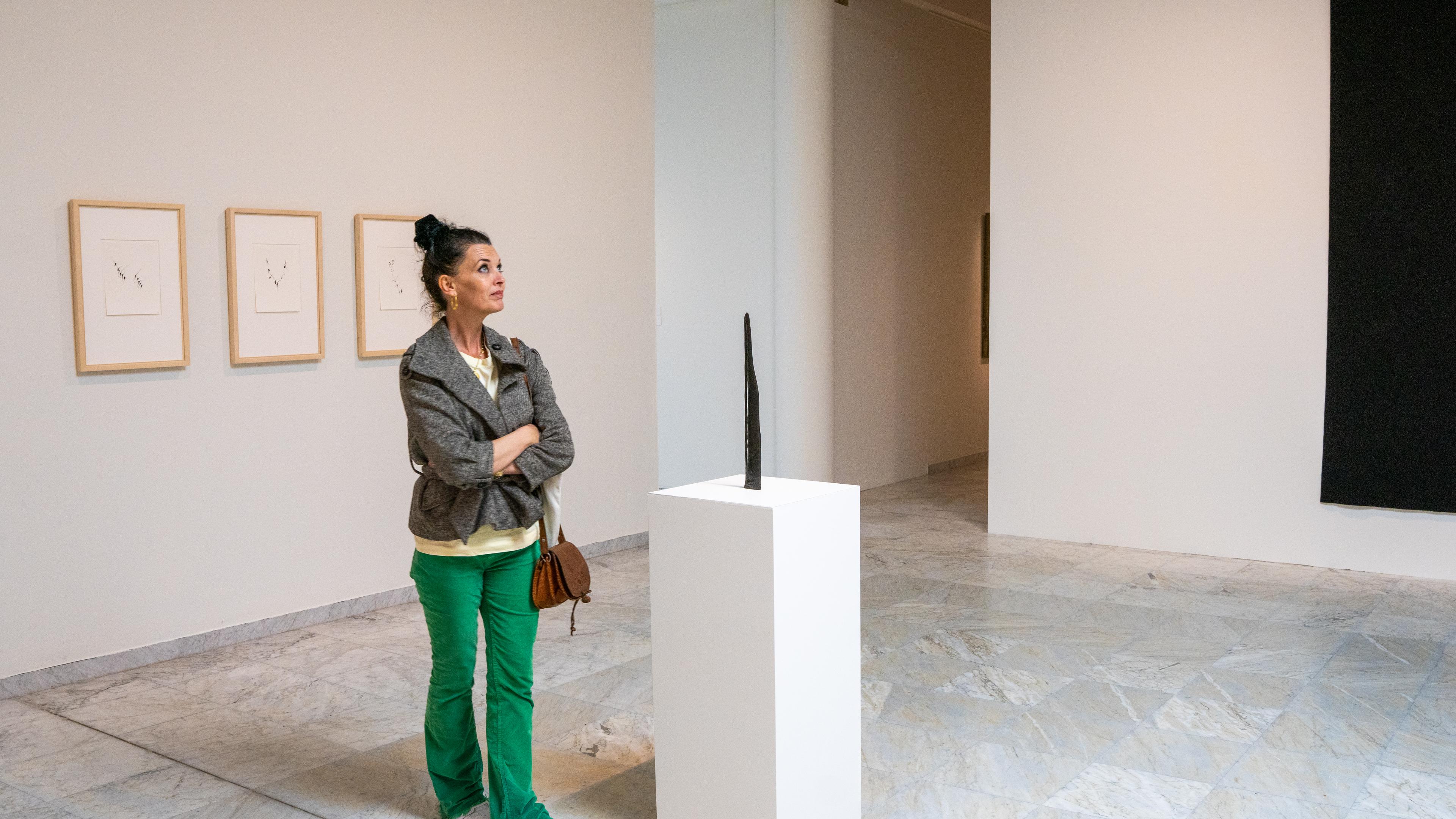 A woman looks at art at the Stavanger Kunstmuseum, Fjord Norway