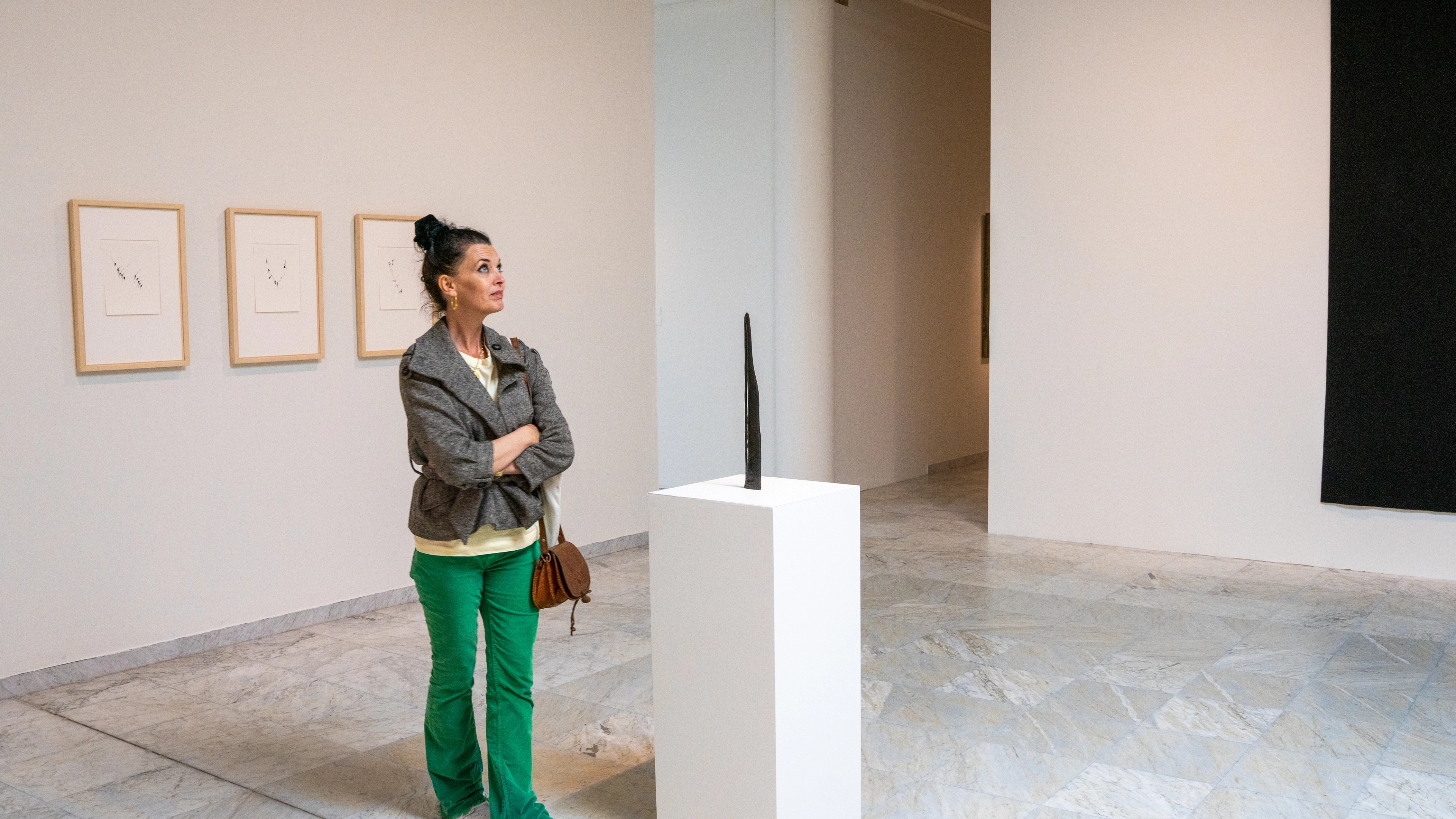A woman looks at art at the Stavanger Kunstmuseum, Fjord Norway
