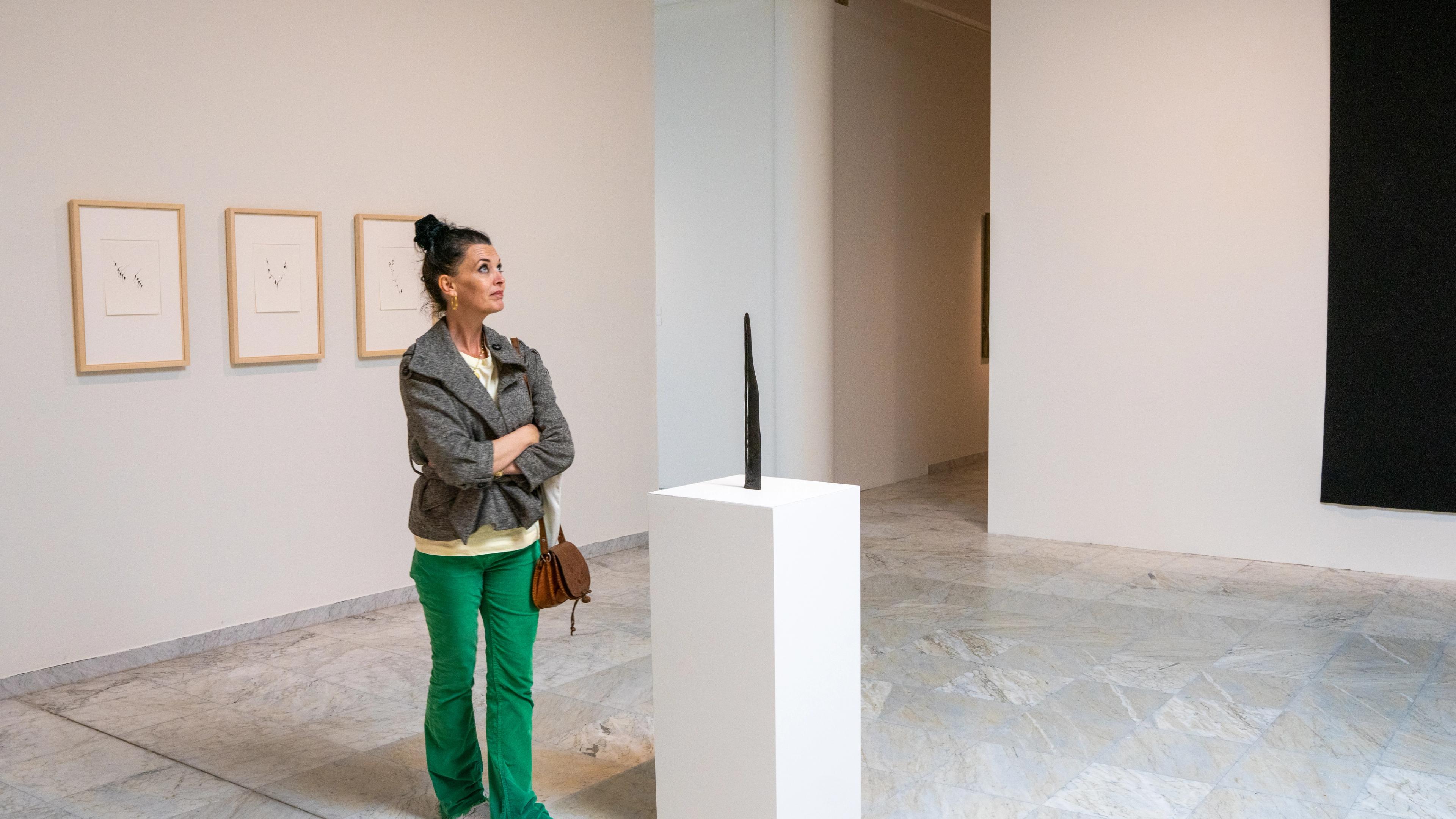 A woman looks at art at the Stavanger Kunstmuseum, Fjord Norway