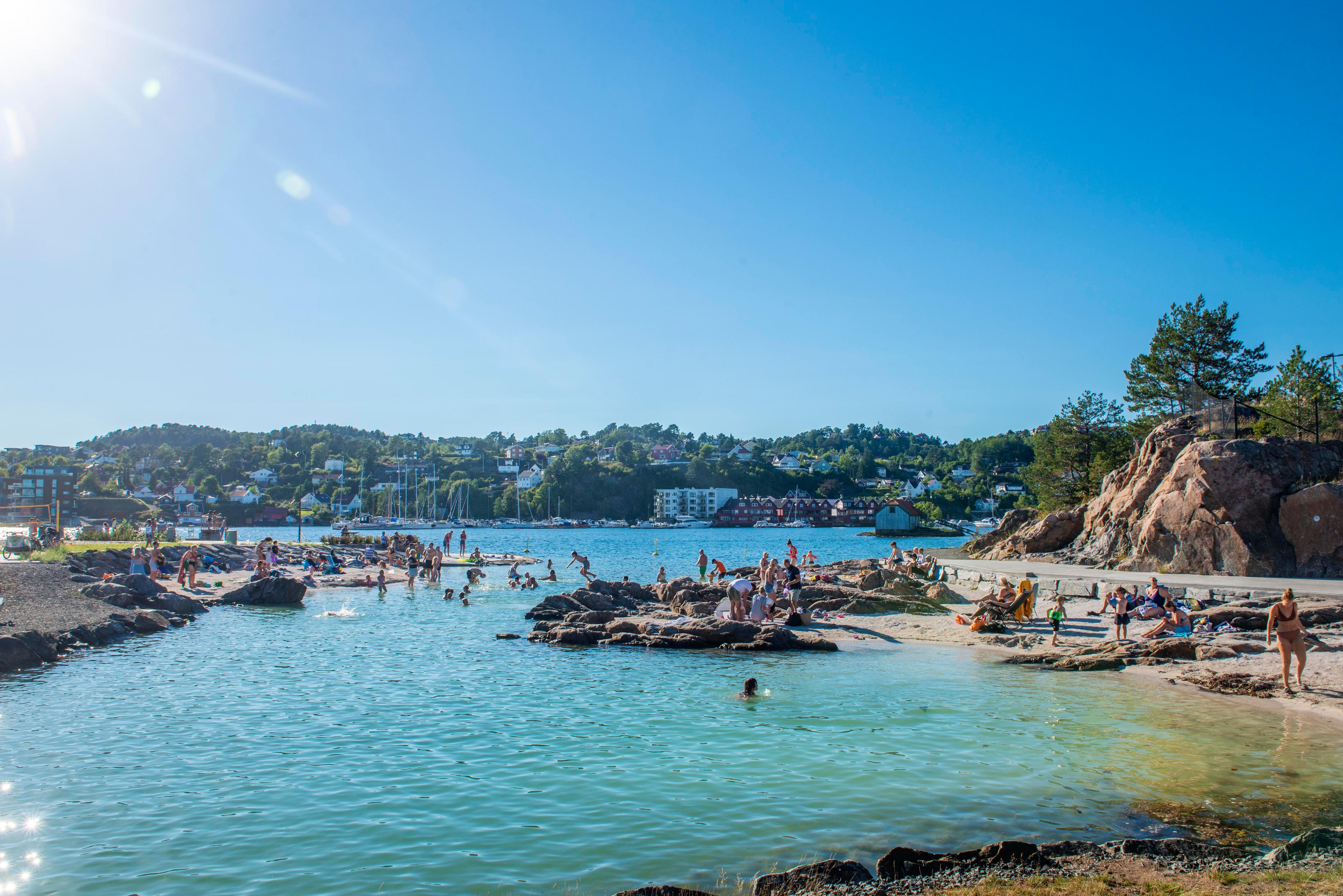 People bathing at the Løkholmen beach outside Arendal