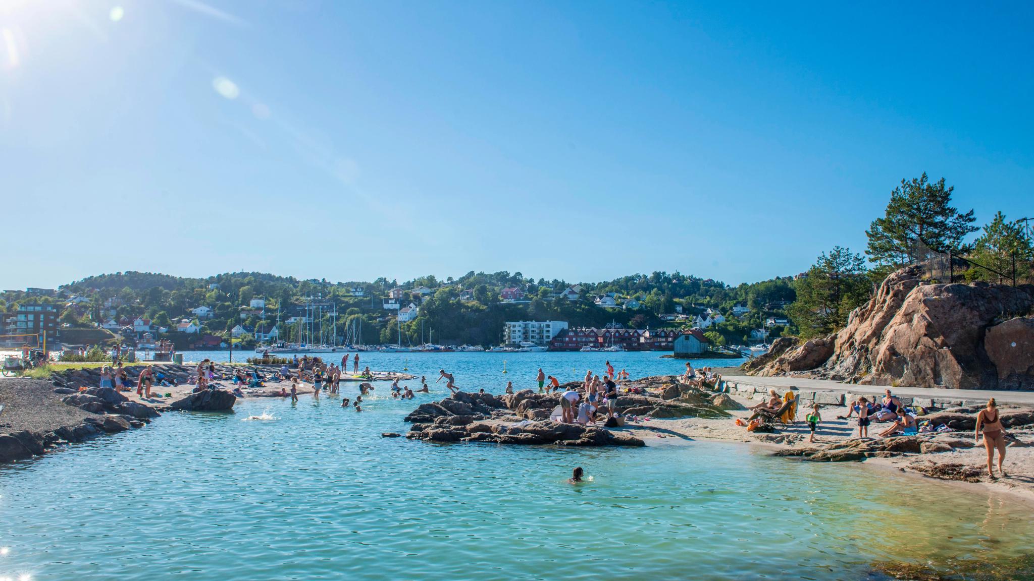 People bathing at the Løkholmen beach outside Arendal