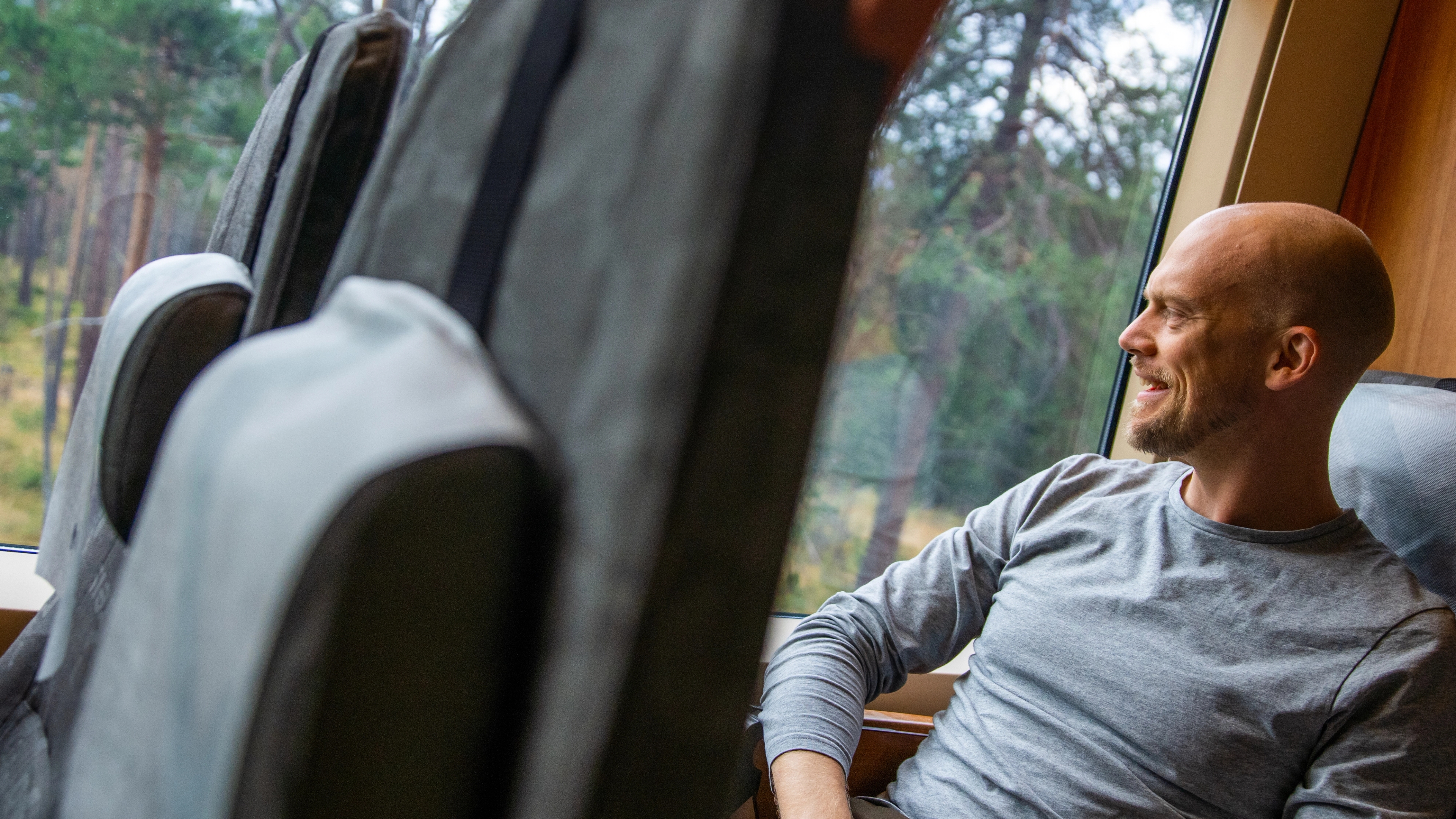 A man sits in a seat at the Rauma Railway