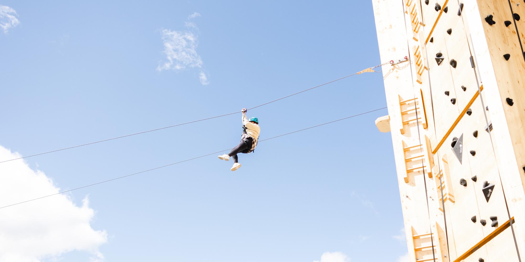 Person zip lining at Geilo summer park, Eastern Norway