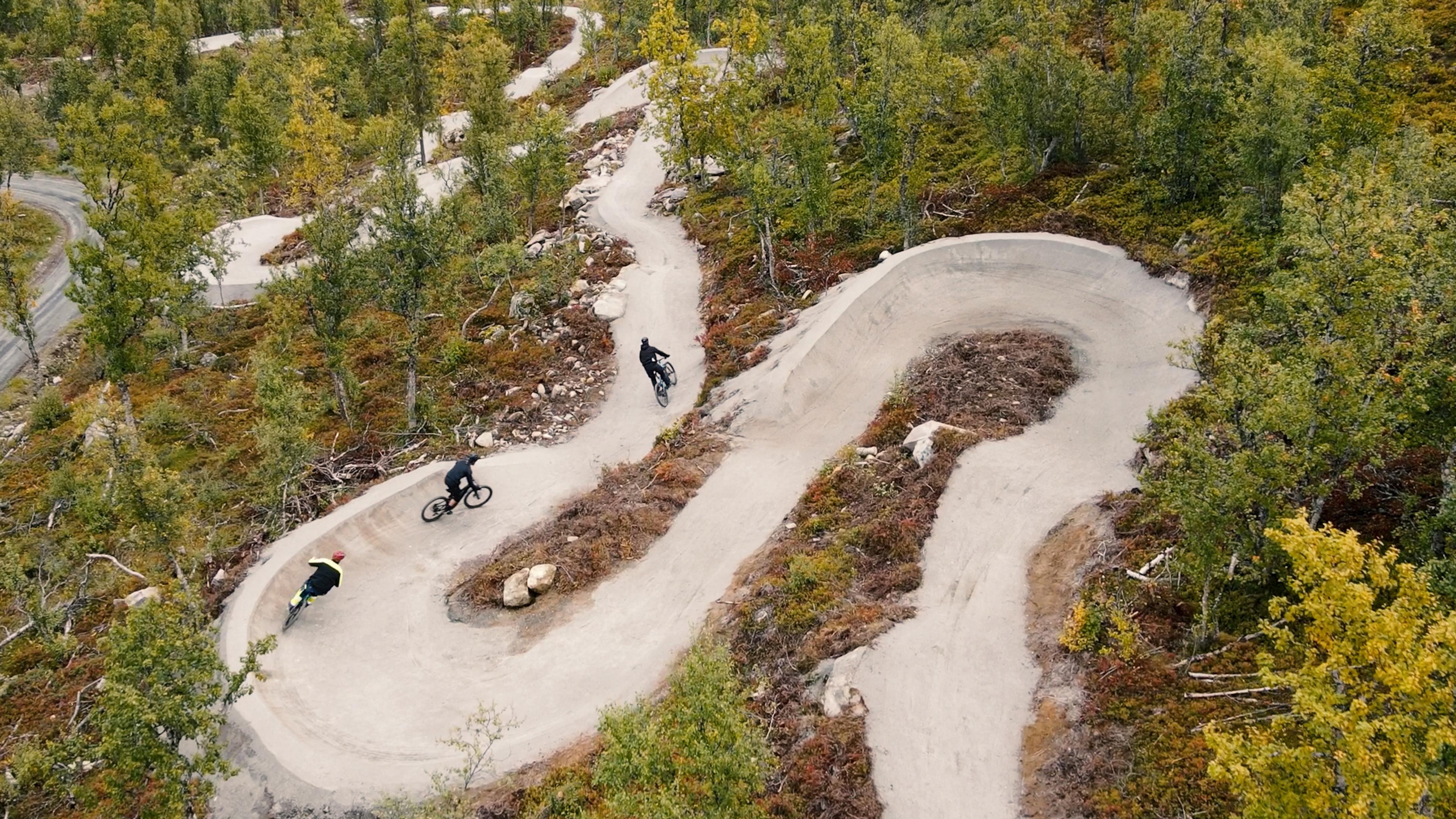 Three persons biking in Geilo biking park, Eastern Norway