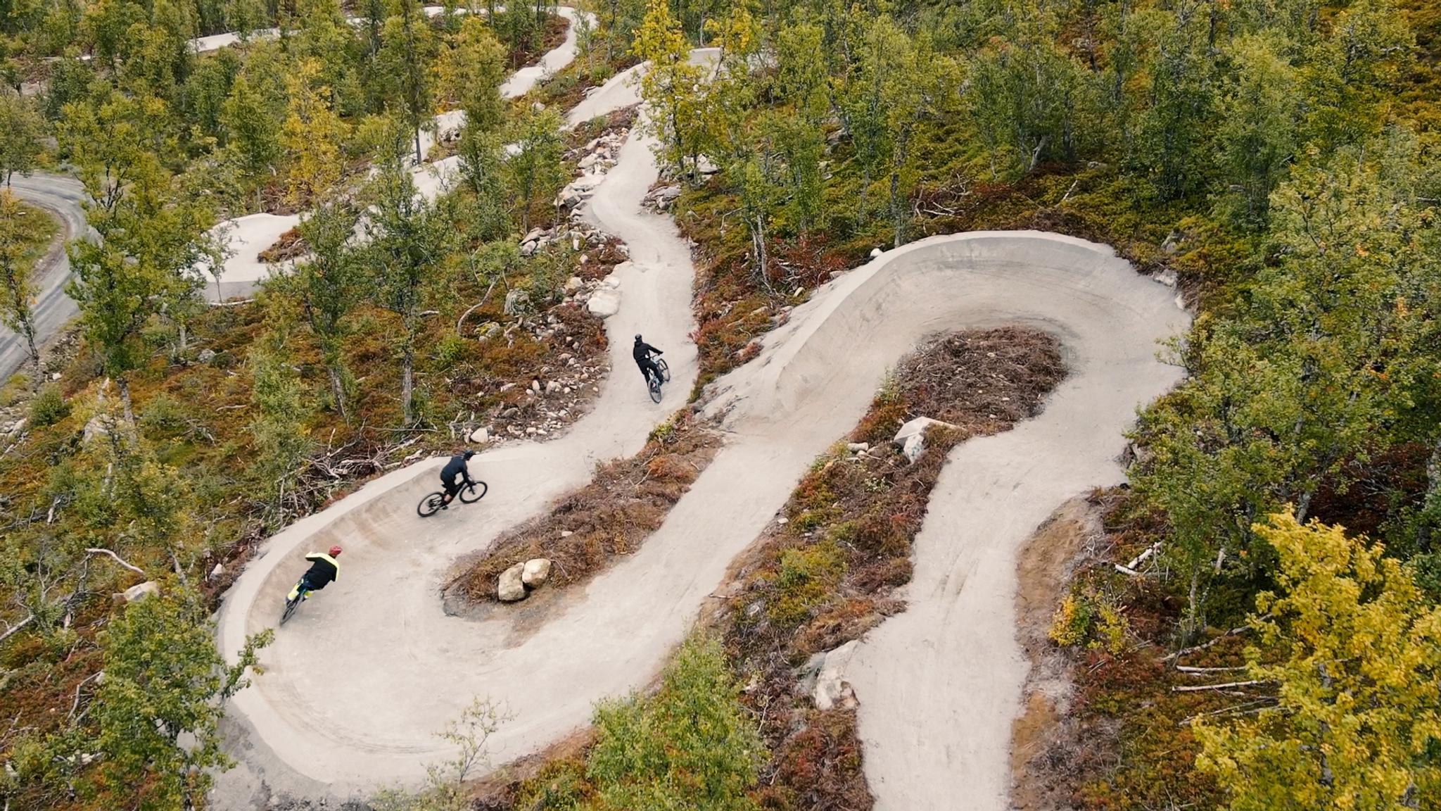 Three persons biking in Geilo biking park, Eastern Norway